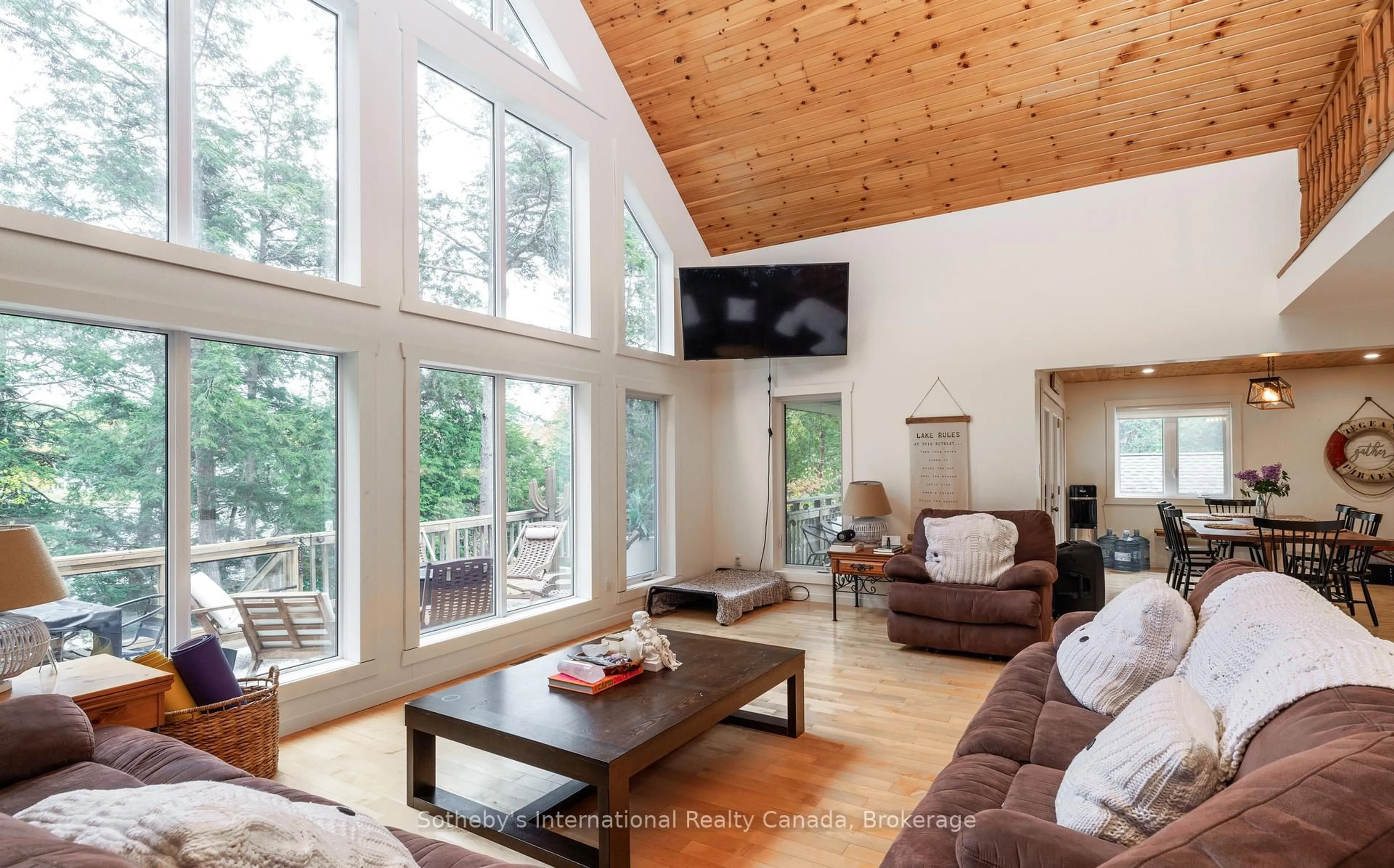 Living room with furniture, wood/laminate floor for 1010 Ransbury Rd, Muskoka Lakes Ontario P0B 1J0
