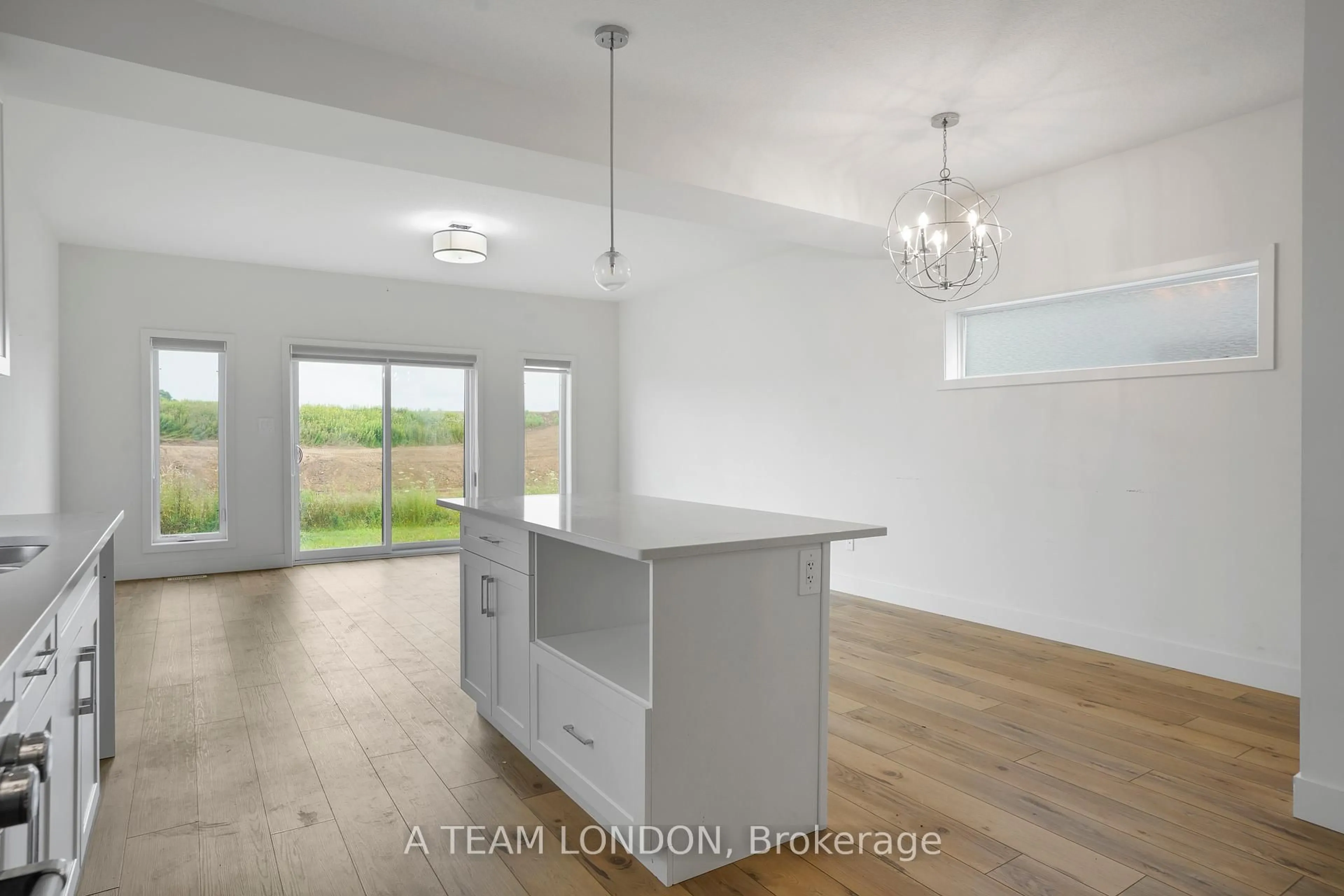 Open concept kitchen, wood/laminate floor for 1612 Capri Cres, London North Ontario N6G 3P2