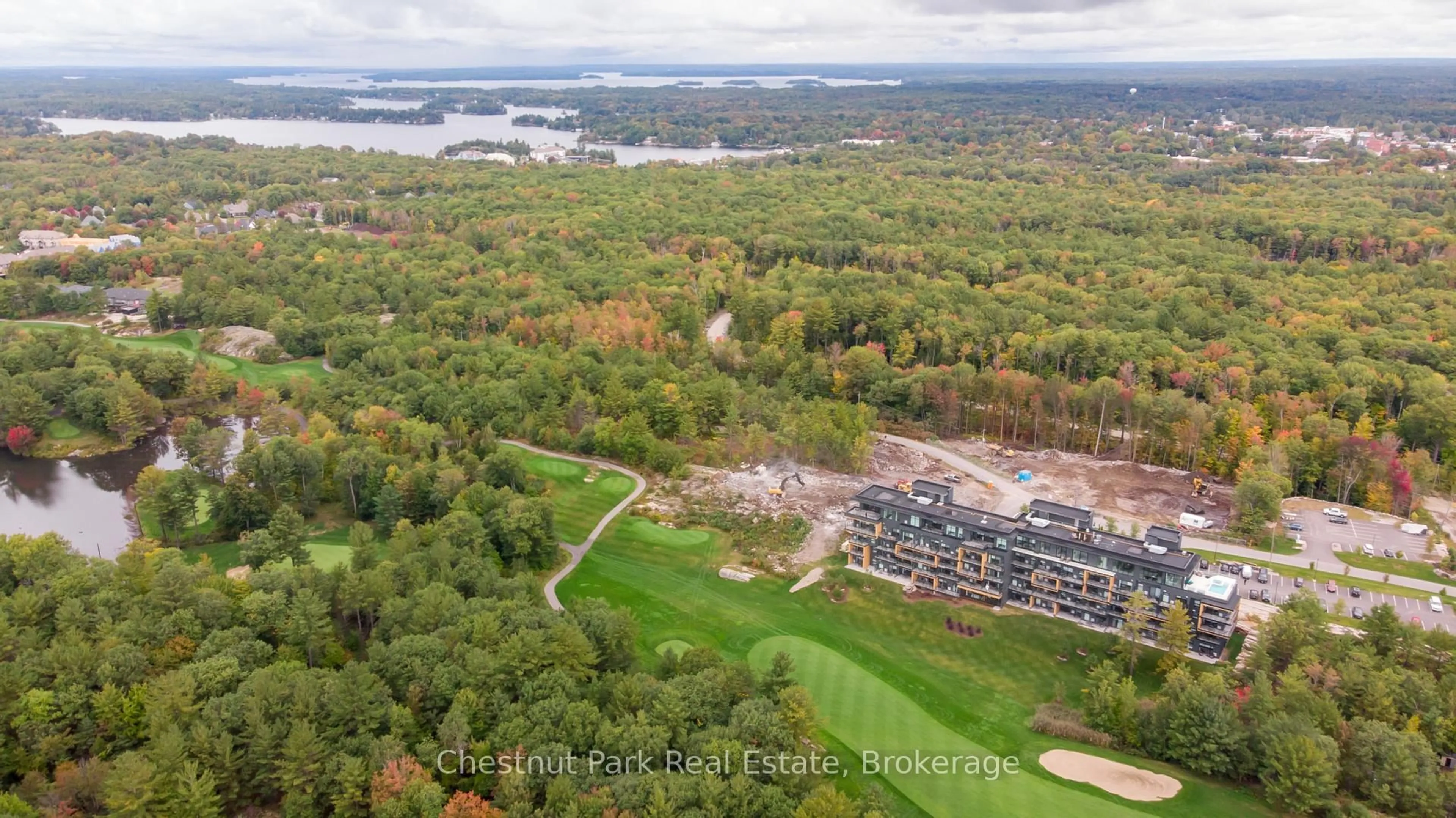 A pic from outside/outdoor area/front of a property/back of a property/a pic from drone, water/lake/river/ocean view for 120 Carrick Tr #404, Gravenhurst Ontario P1P 0B6