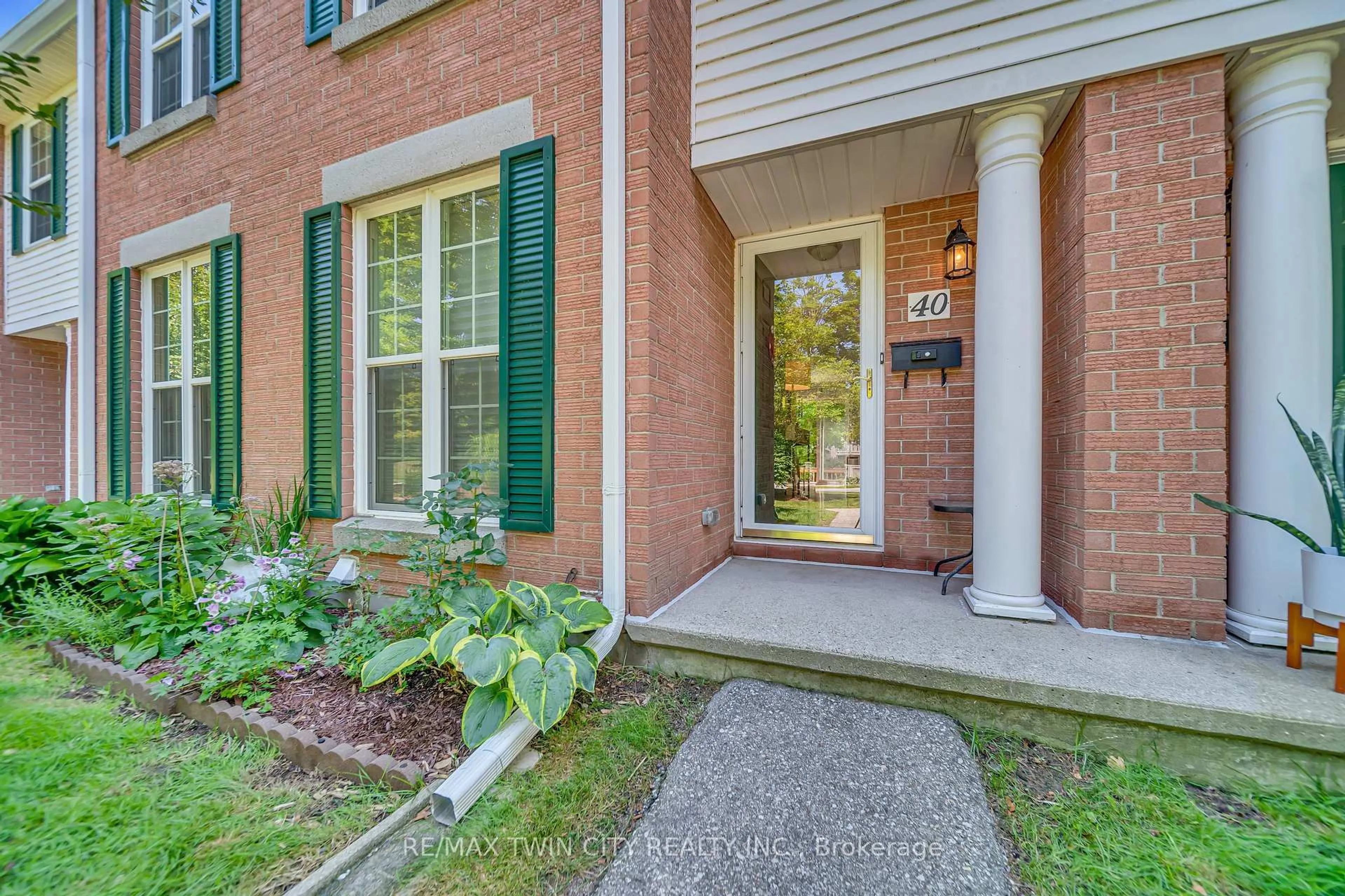 Home with brick exterior material, street for 465 Woolwich St #40, Waterloo Ontario N2K 3S4