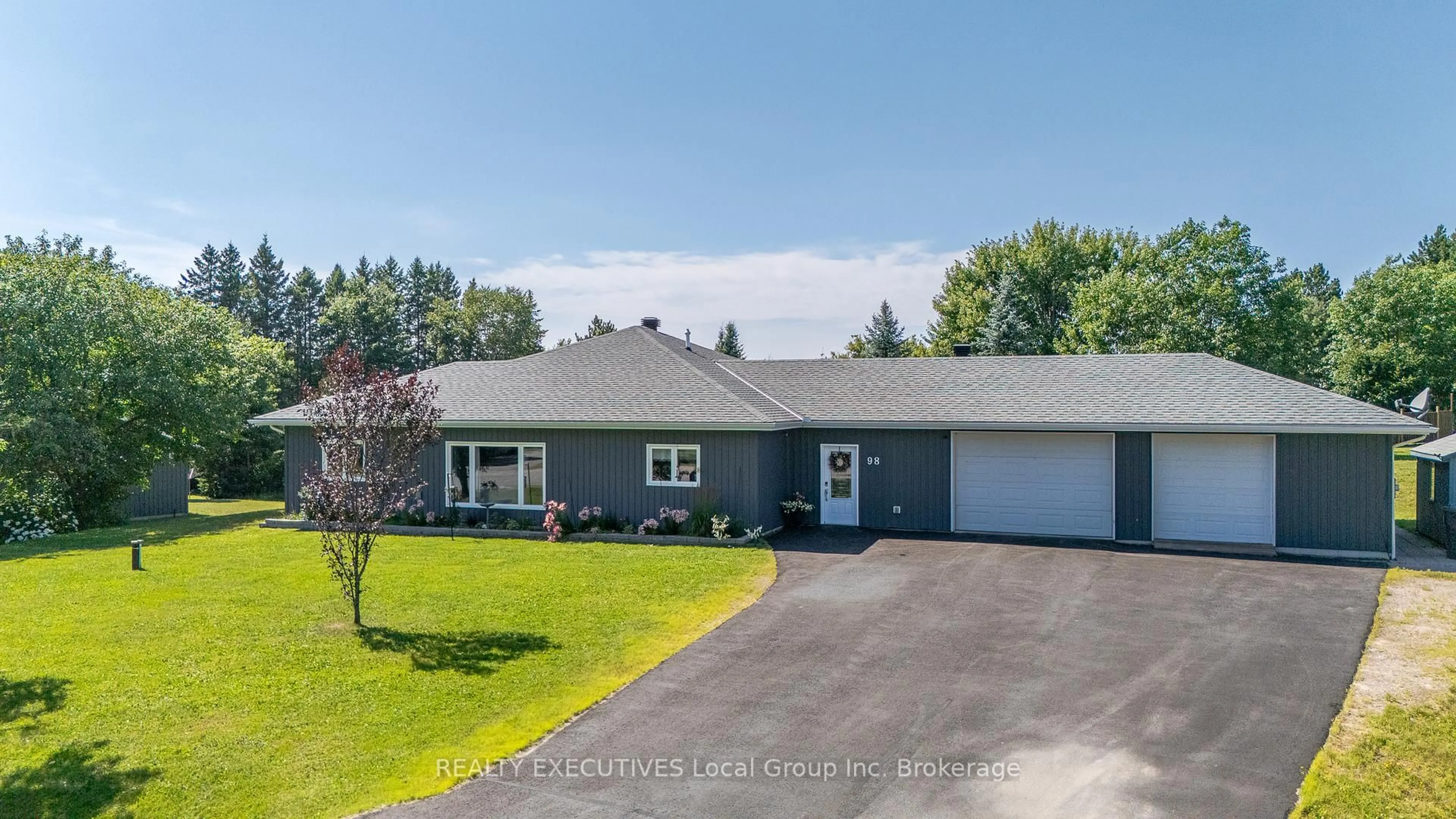 A pic from outside/outdoor area/front of a property/back of a property/a pic from drone, street for 98 Memorial Park Dr, Powassan Ontario P0H 1Z0