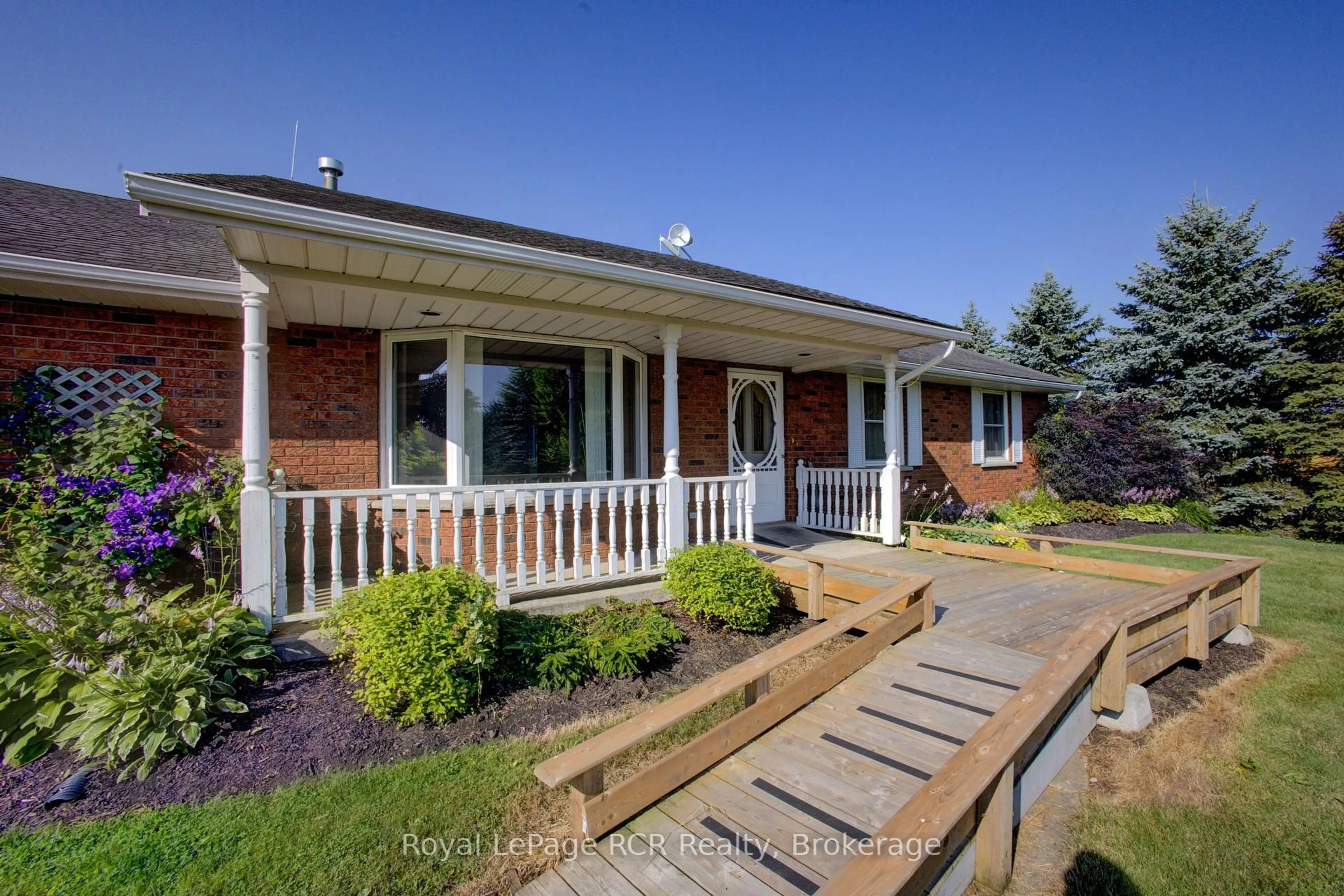 Home with vinyl exterior material, street for 7218 16th Line, Mapleton Ontario N0G 1A0
