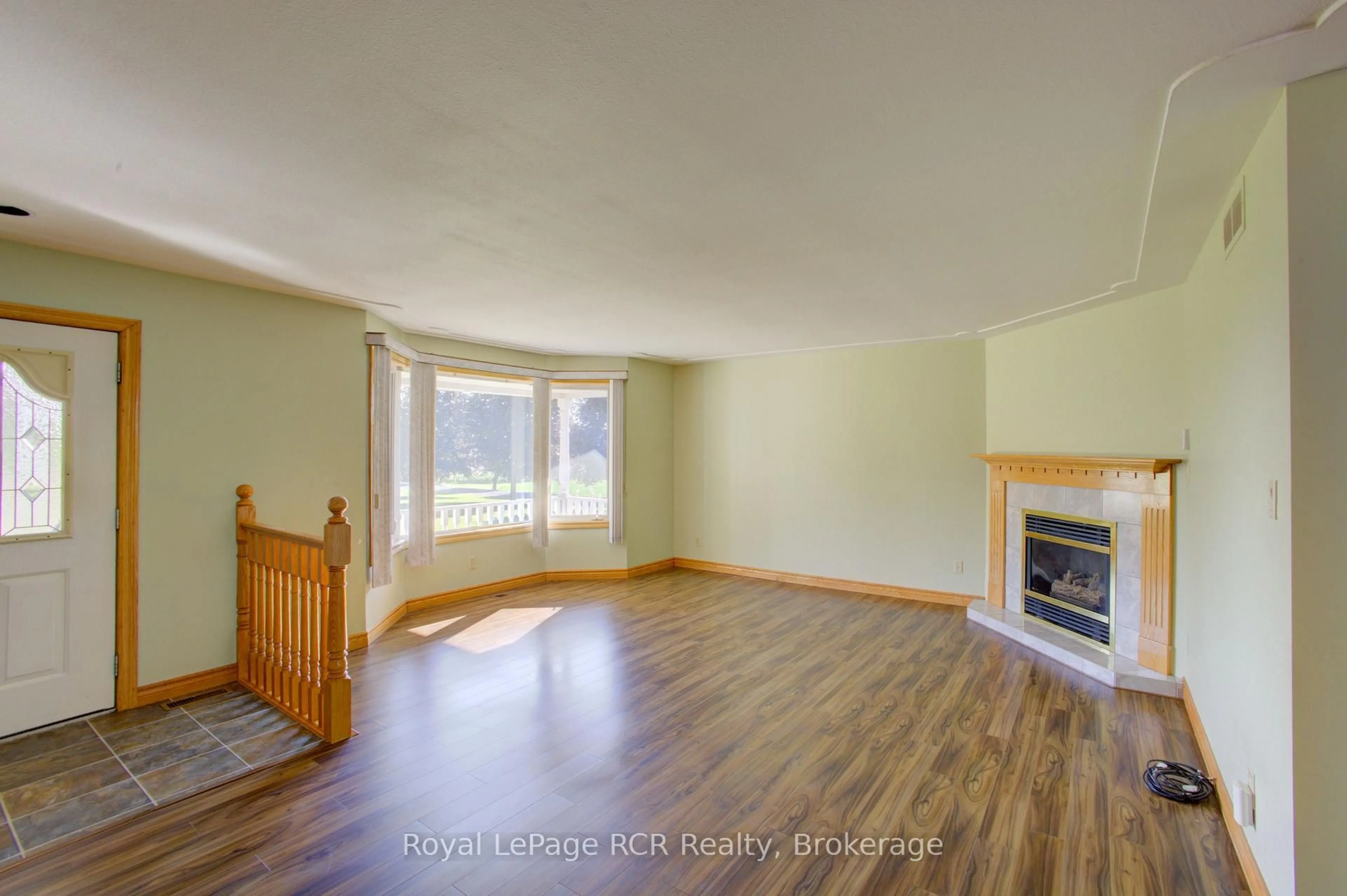 Living room with furniture, wood/laminate floor for 7218 16th Line, Mapleton Ontario N0G 1A0