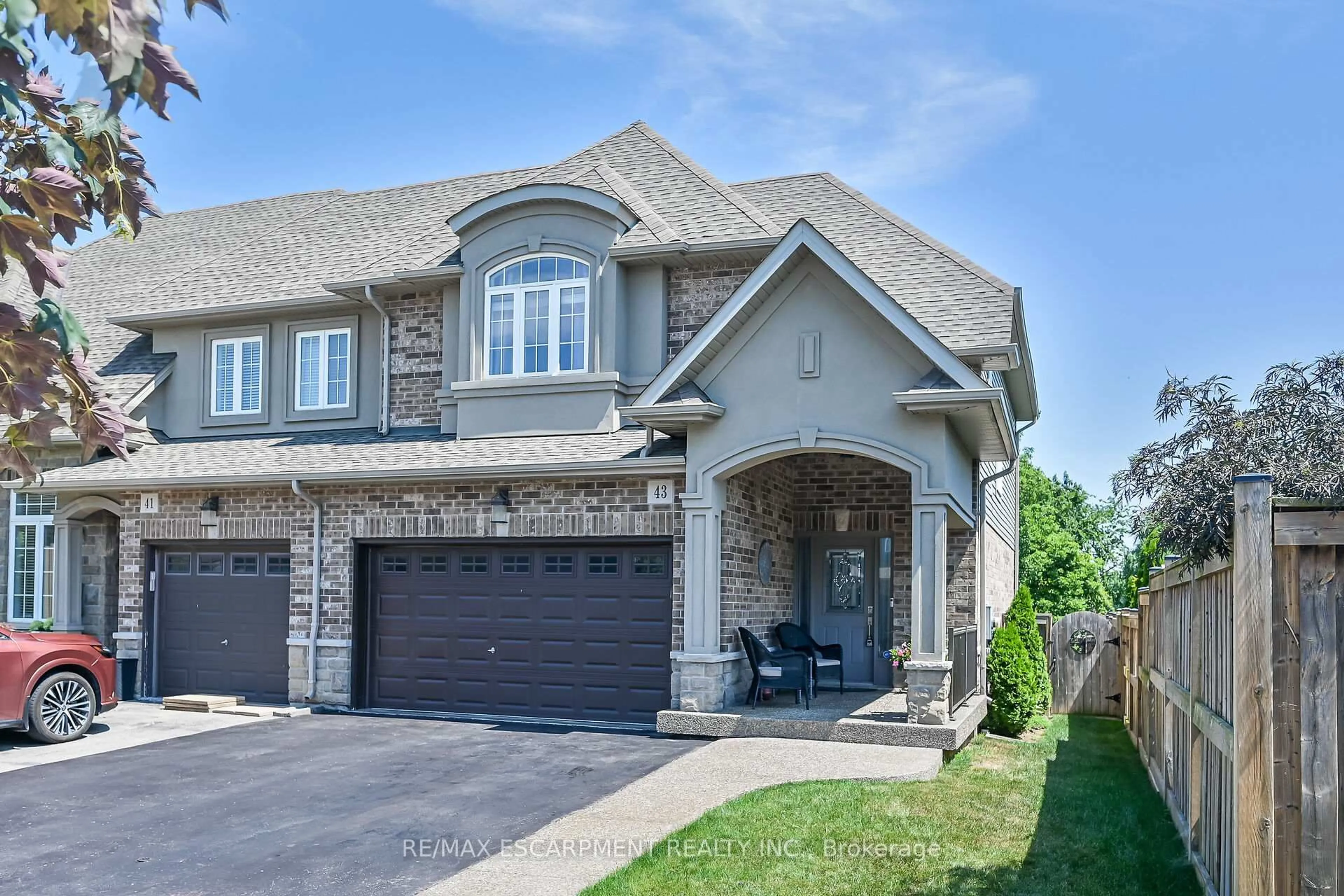 Home with brick exterior material, street for 43 Medici Lane, Hamilton Ontario L8B 0G9
