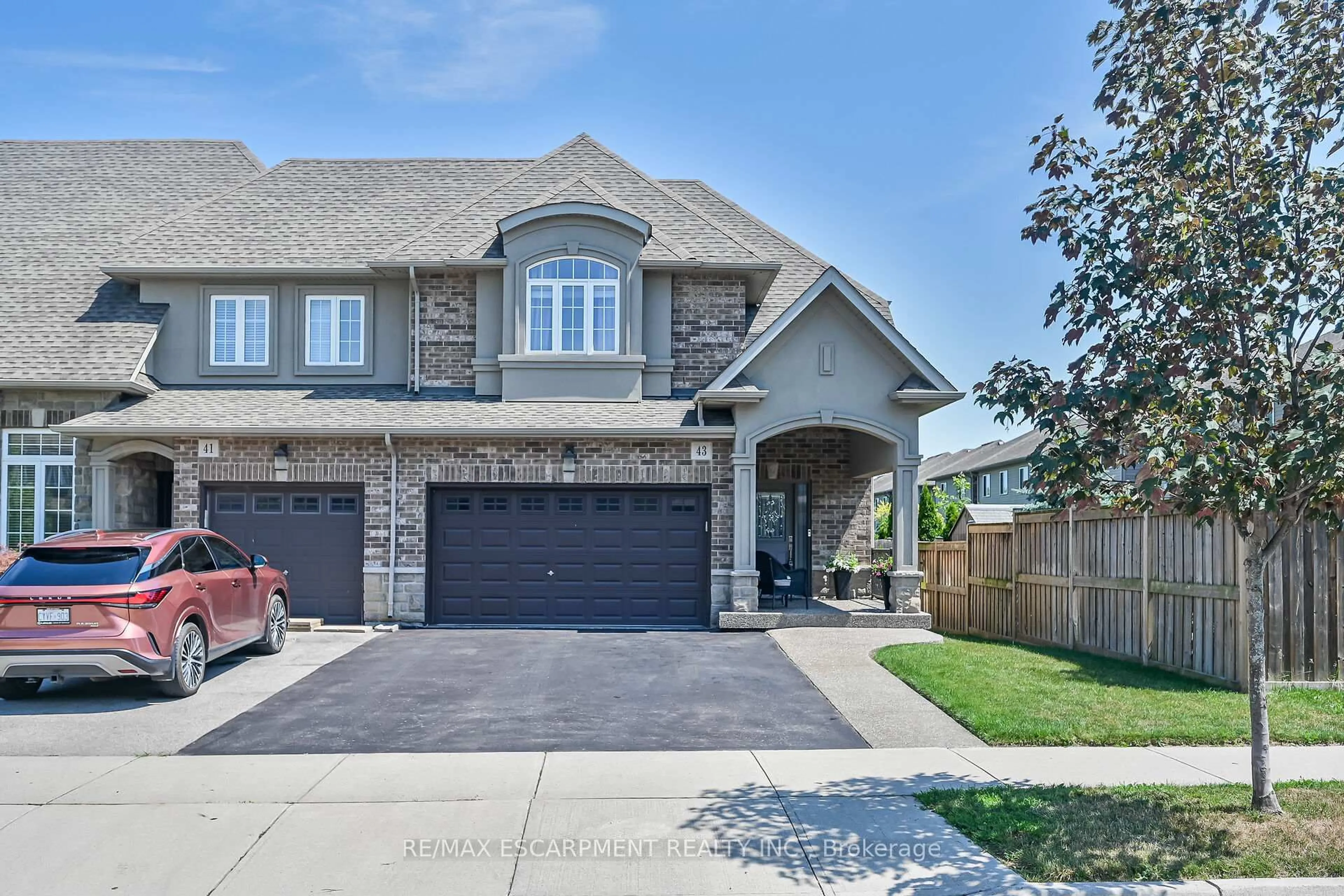 Home with brick exterior material, street for 43 Medici Lane, Hamilton Ontario L8B 0G9