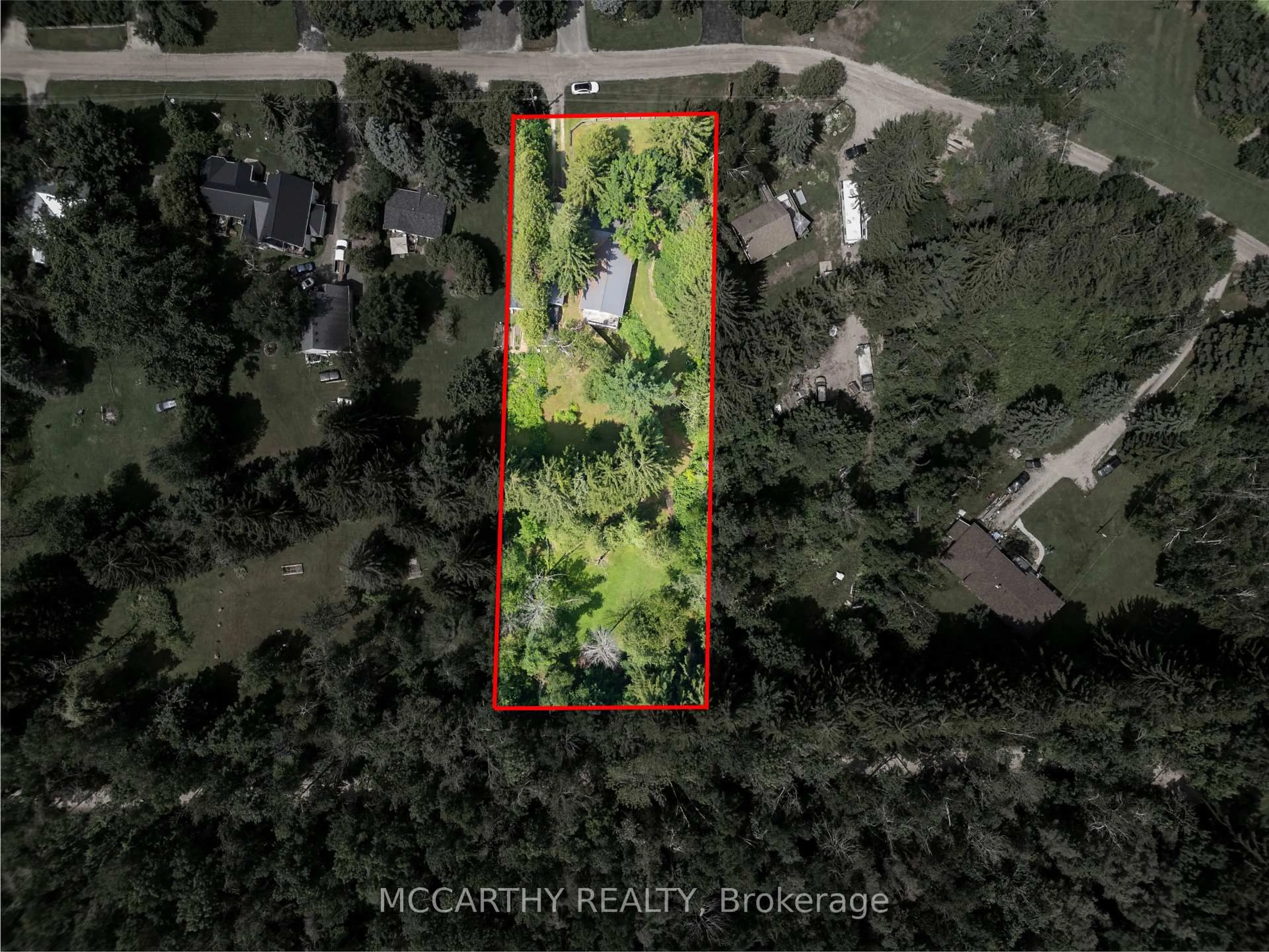A pic from outside/outdoor area/front of a property/back of a property/a pic from drone, forest/trees view for 21 McCutcheon Rd, Mulmur Ontario L9V 3E8