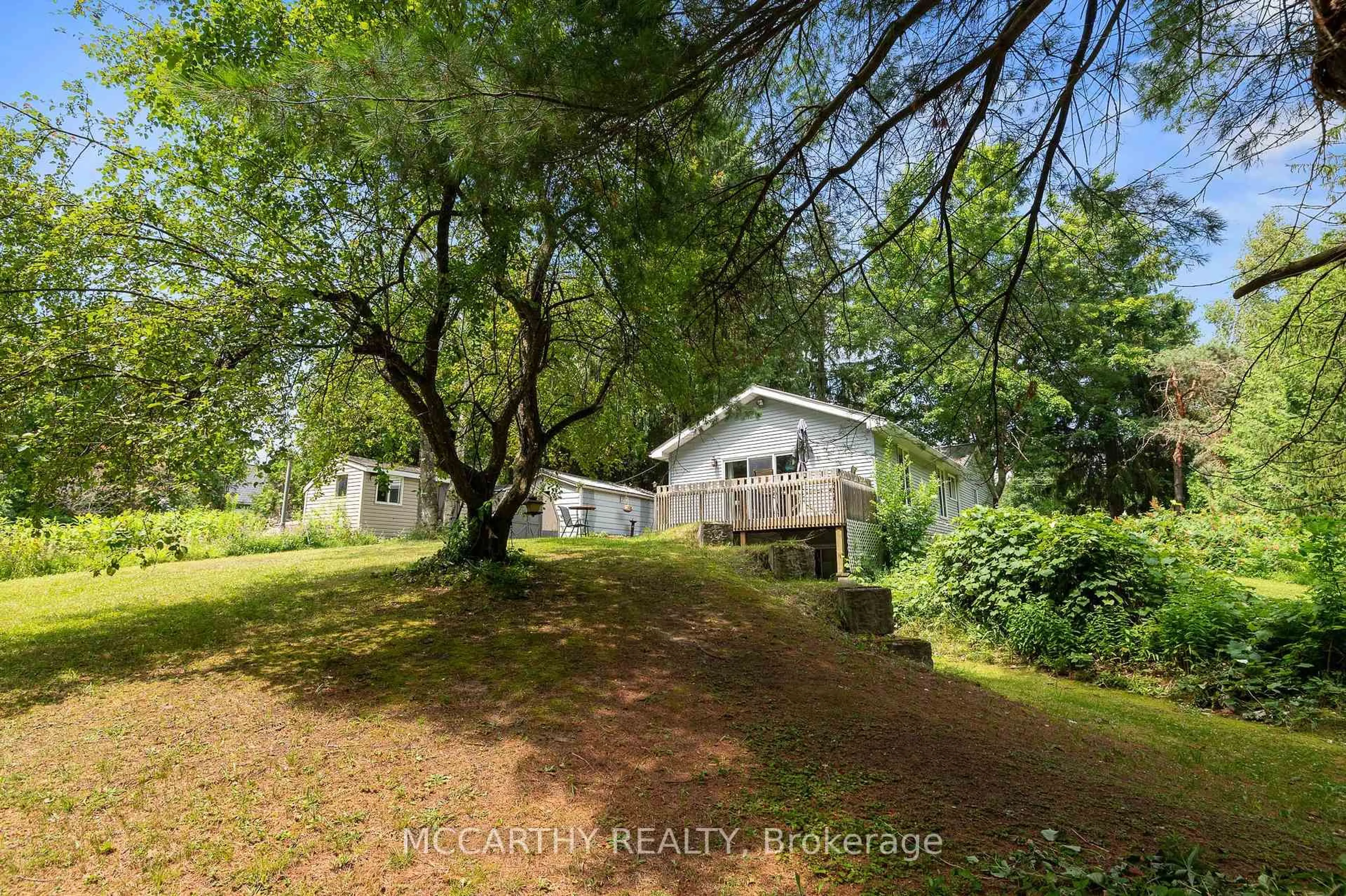 A pic from outside/outdoor area/front of a property/back of a property/a pic from drone, forest/trees view for 21 McCutcheon Rd, Mulmur Ontario L9V 3E8