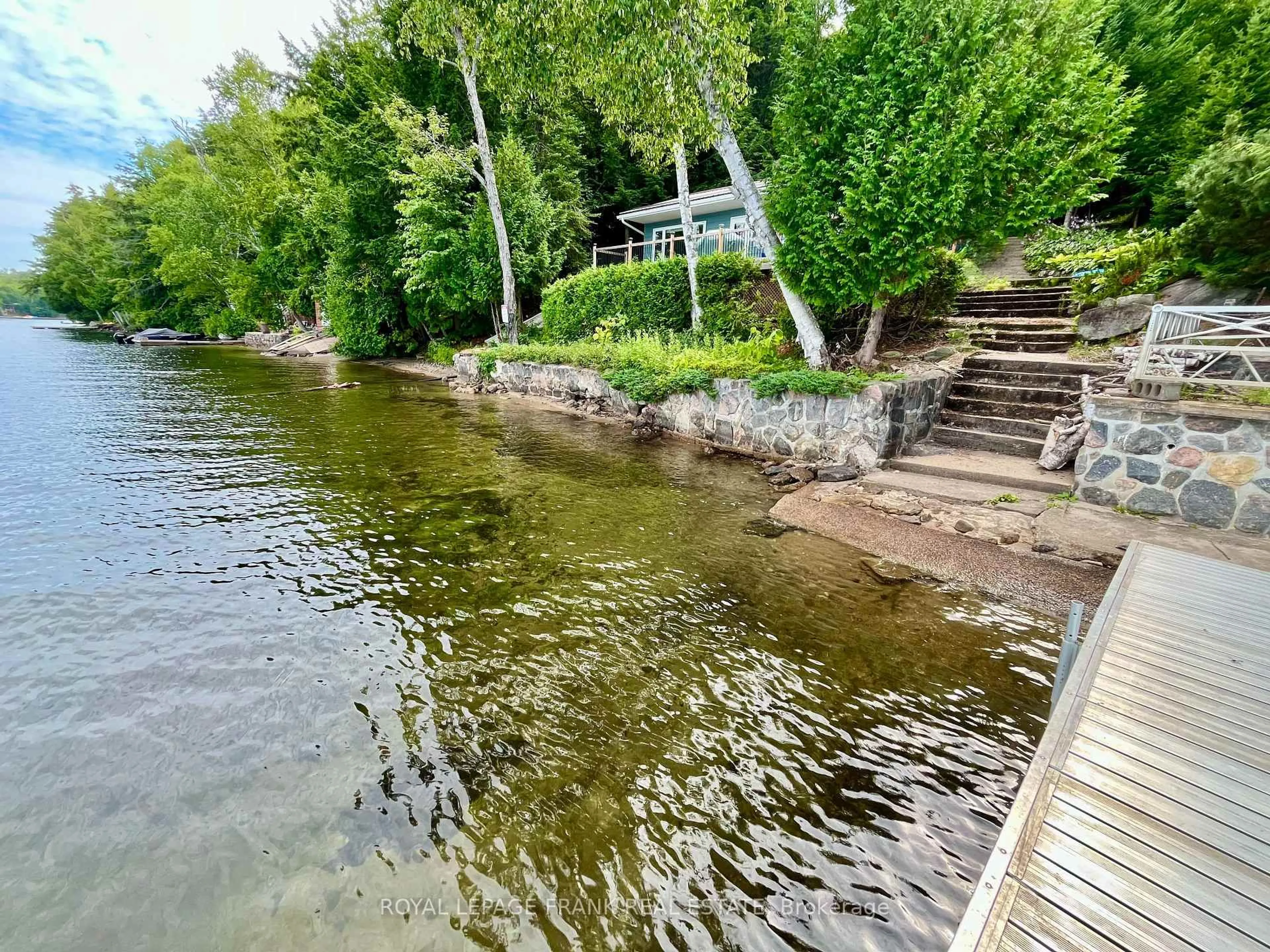 A pic from outside/outdoor area/front of a property/back of a property/a pic from drone, water/lake/river/ocean view for 1700 Papineau Lake Rd, Maple Leaf Ontario K0L 2R0