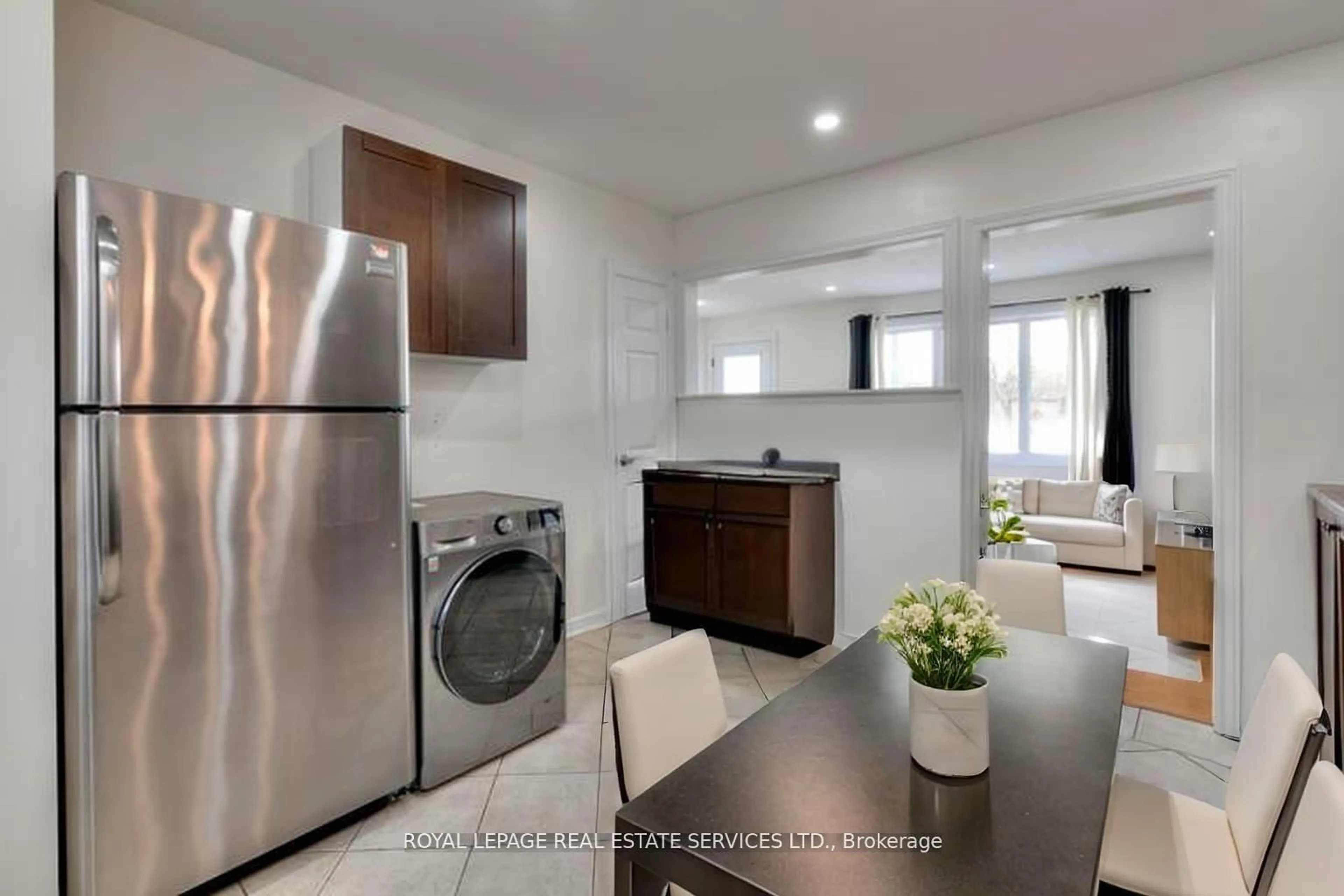 Kitchen with laundary machines, ceramic/tile floor for 484 Speedvale Ave, Guelph Ontario N1E 1P2