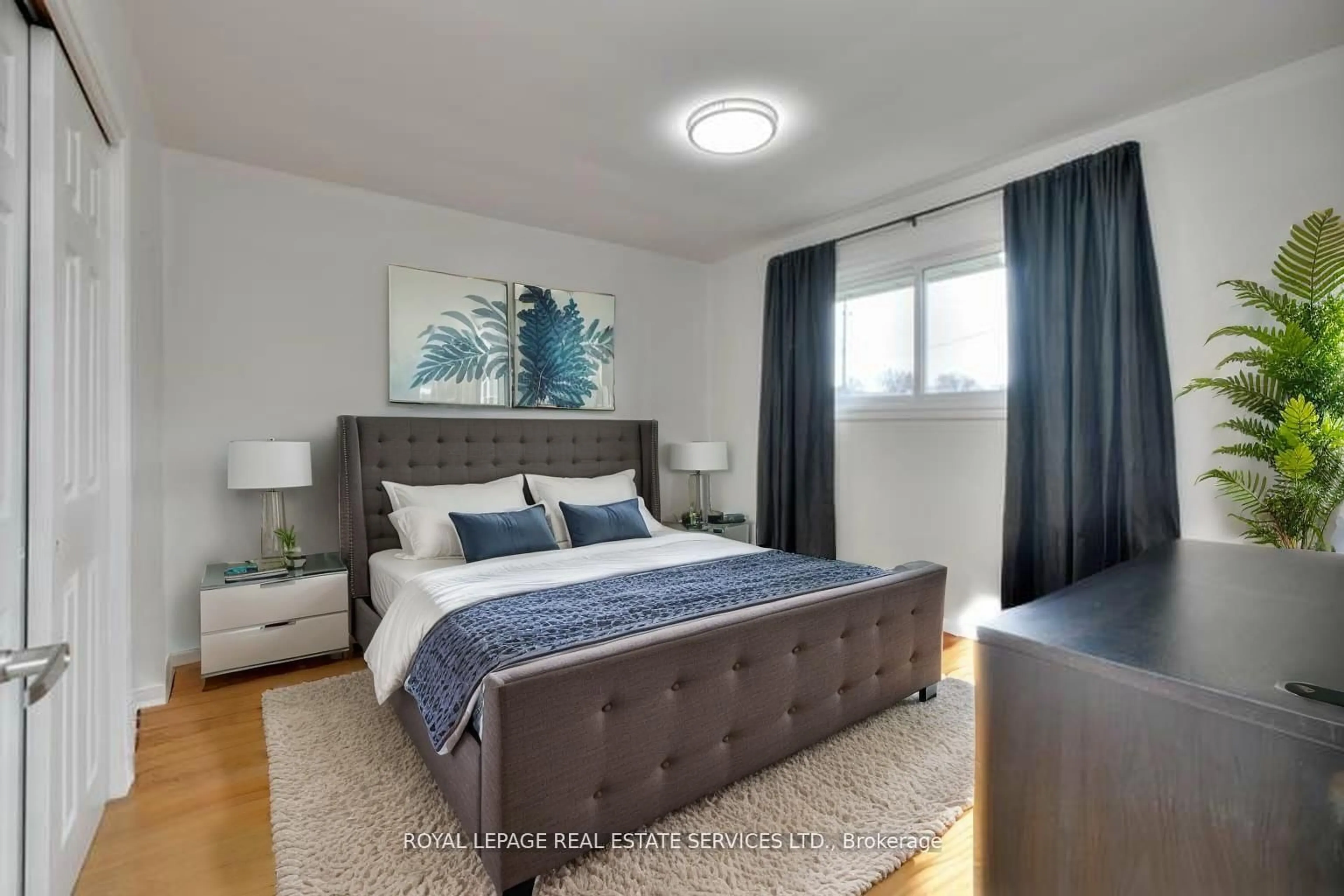 Bedroom with bed, wood/laminate floor for 484 Speedvale Ave, Guelph Ontario N1E 1P2