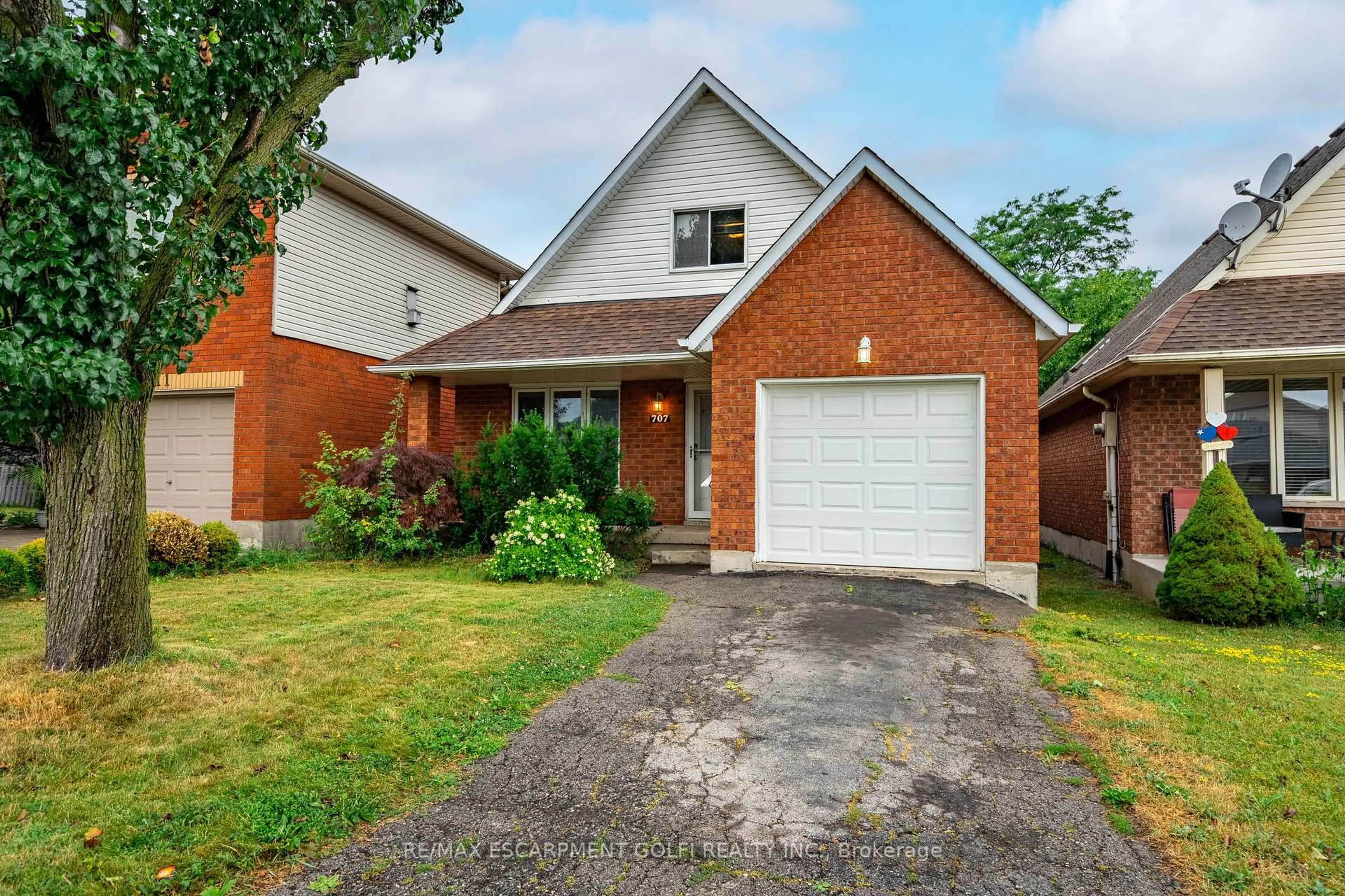 Home with brick exterior material, street for 707 Acadia Dr, Hamilton Ontario L8W 3V2