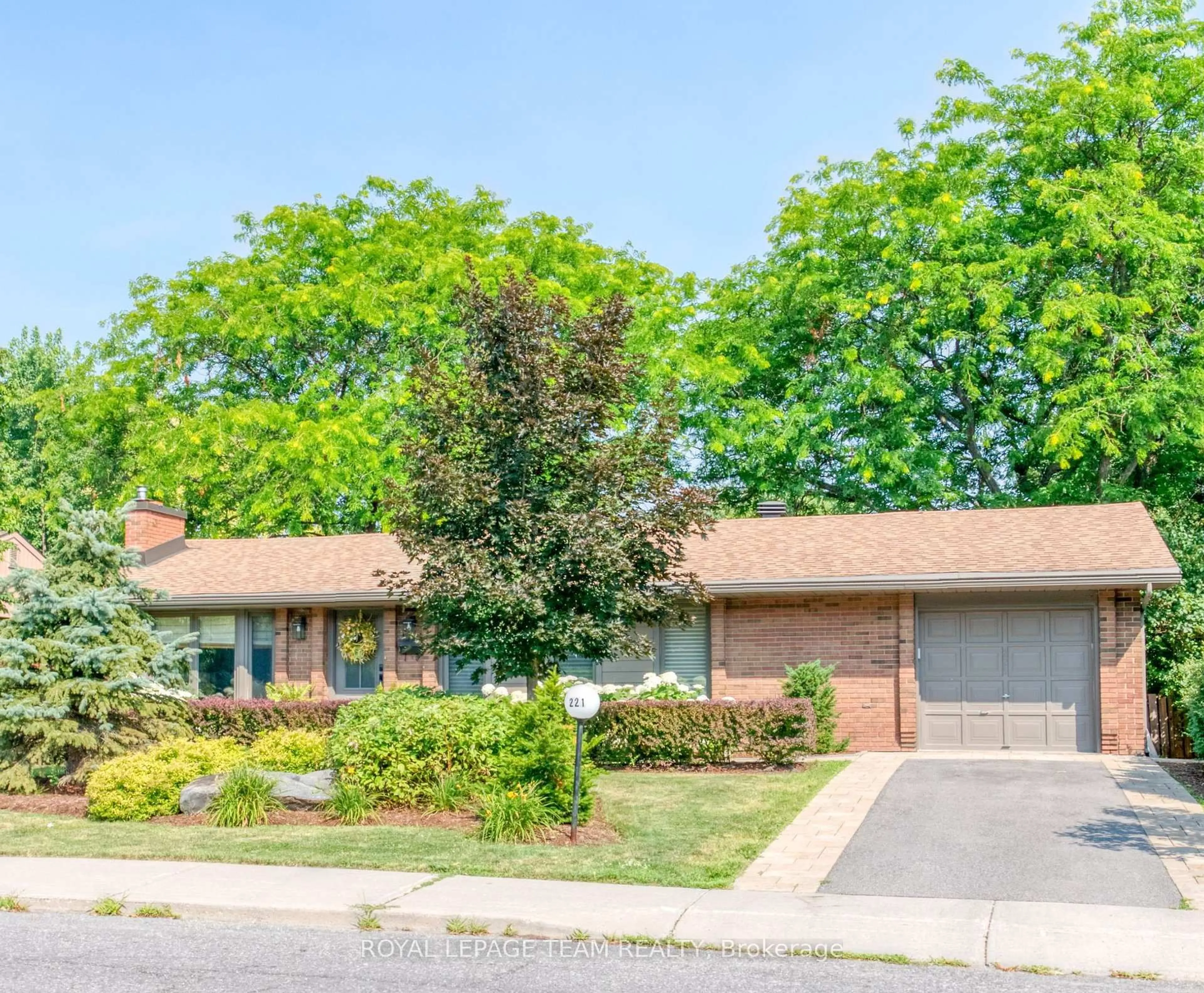 Home with brick exterior material, street for 221 Penfield Dr, Ottawa Ontario K2K 1M8