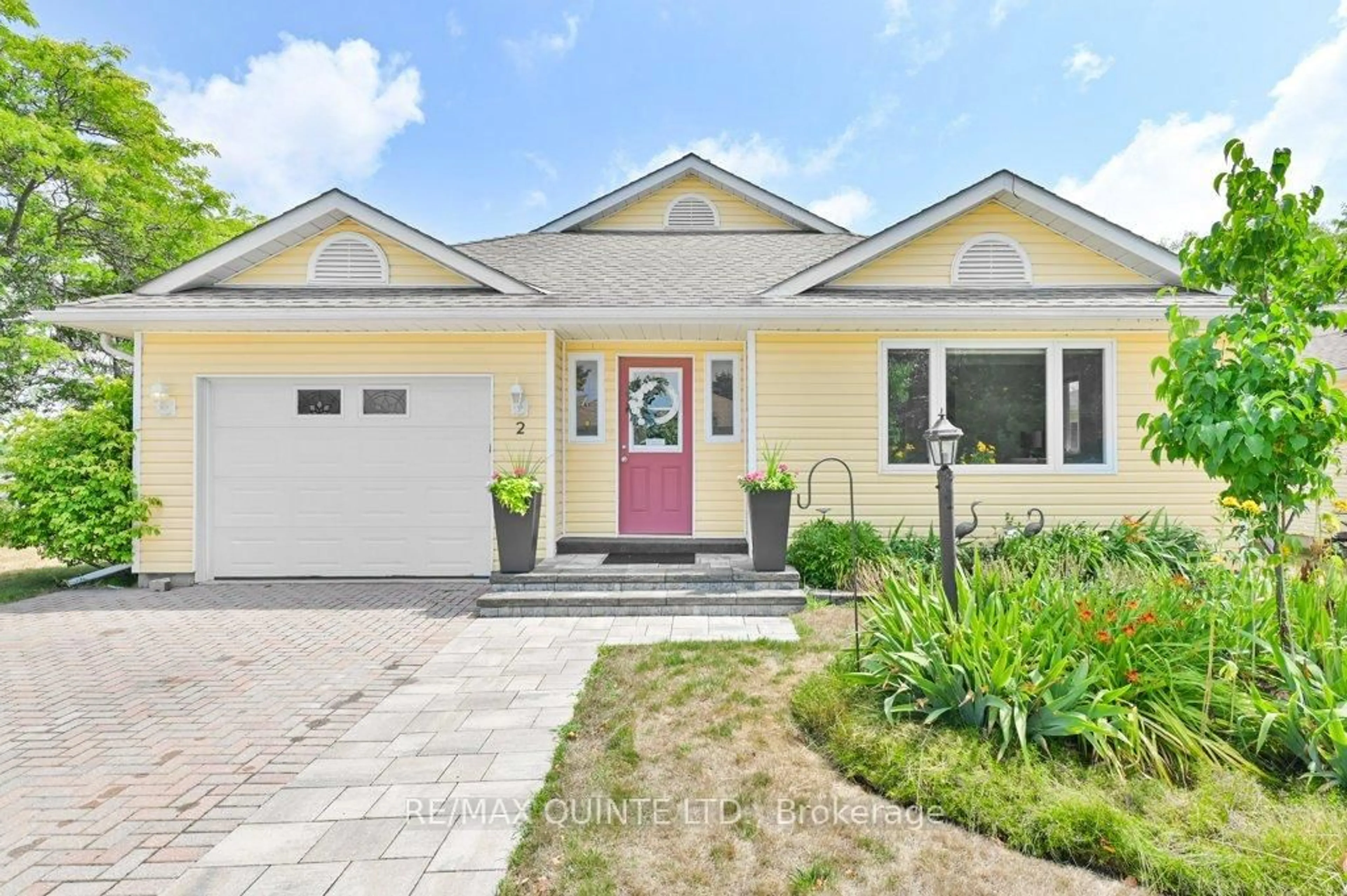 Home with vinyl exterior material, street for 2 Heritage Dr, Prince Edward County Ontario K0K 3L0