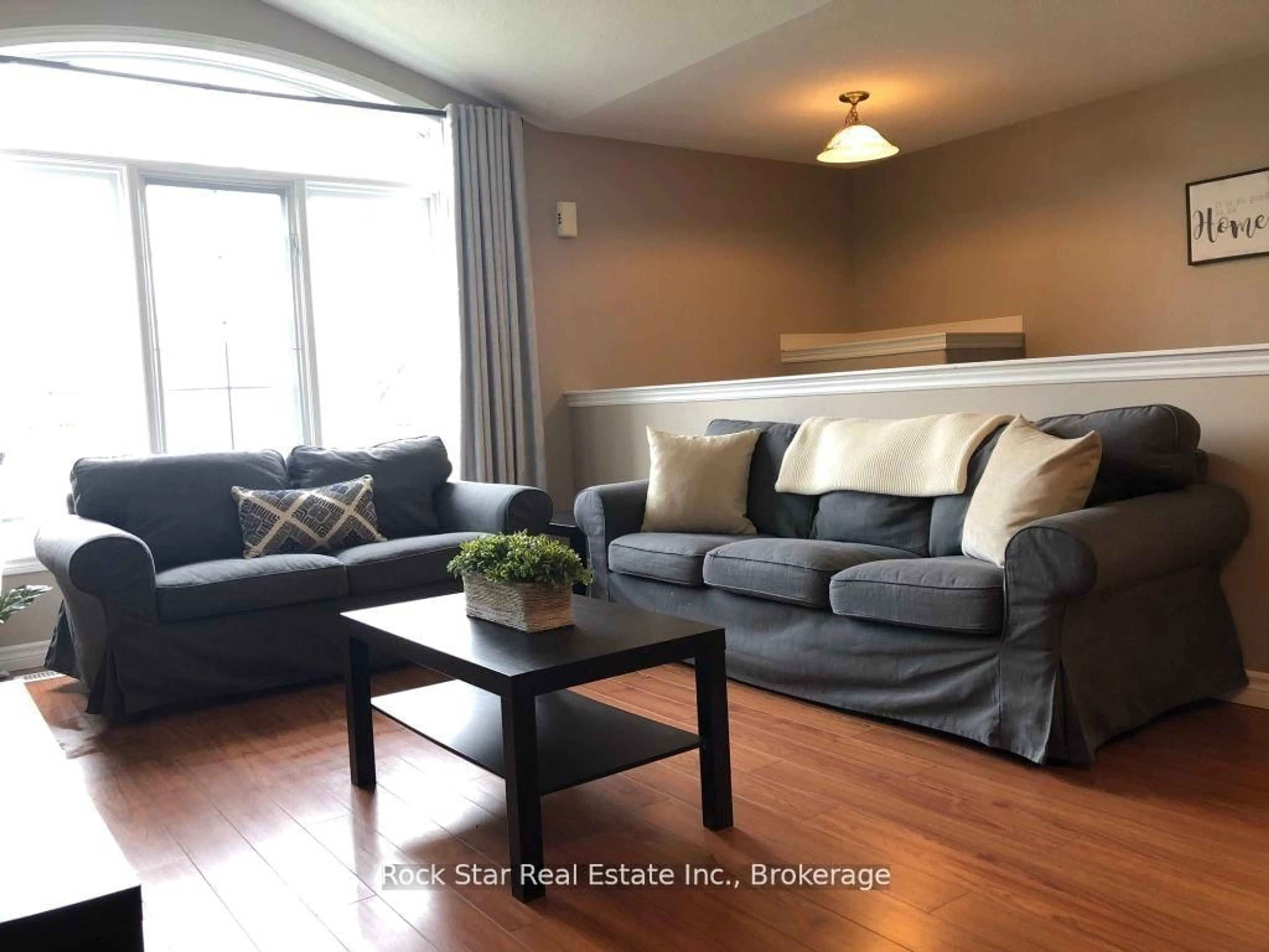 Living room with furniture, wood/laminate floor for 12 Follwell Cres, Belleville Ontario K8N 5Z5