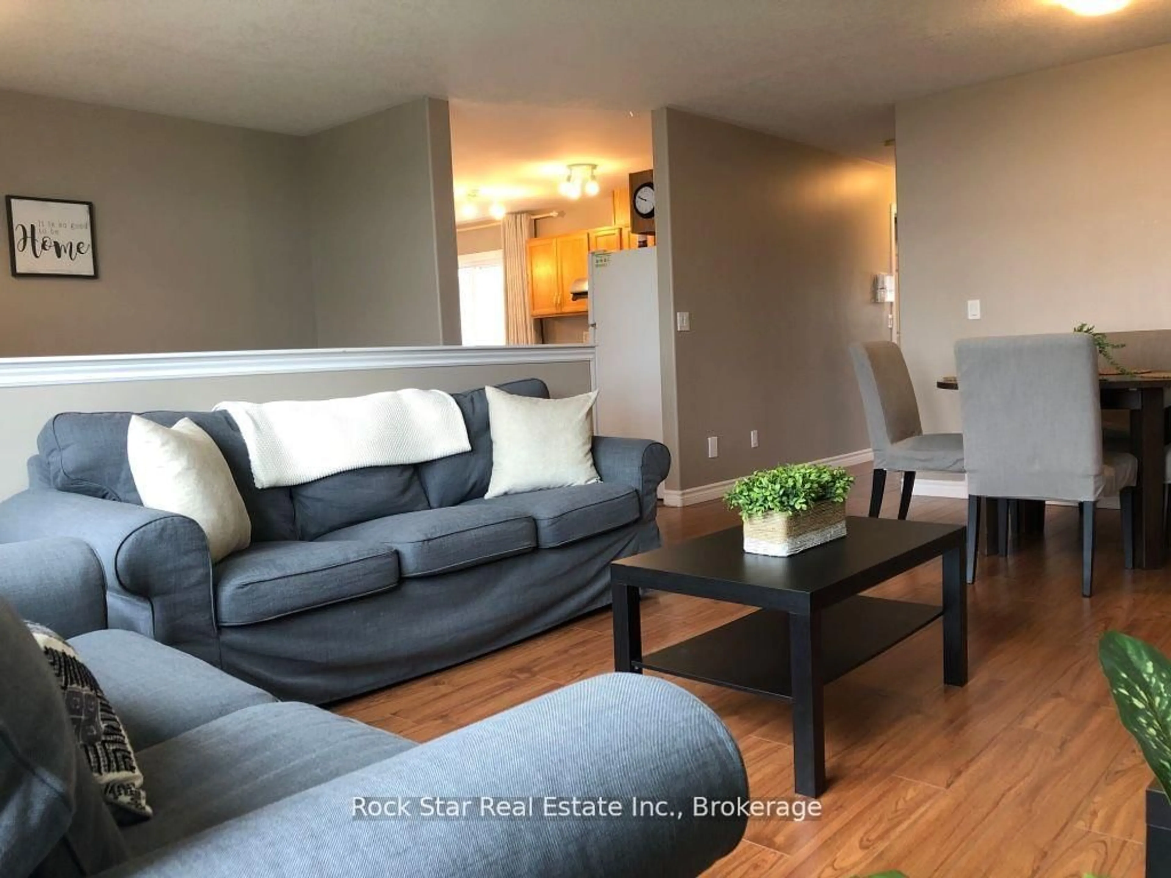 Living room with furniture, wood/laminate floor for 12 Follwell Cres, Belleville Ontario K8N 5Z5