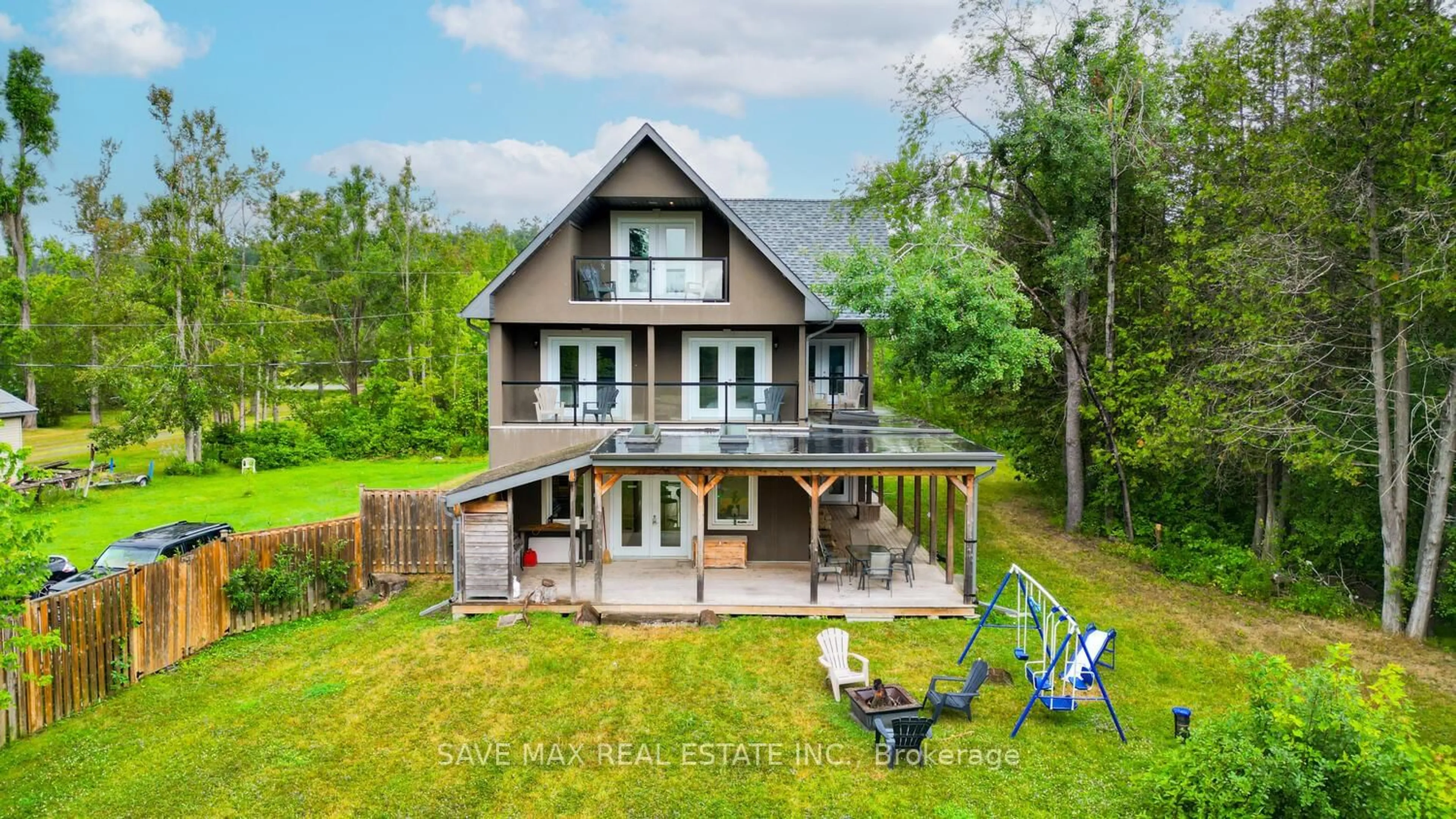 A pic from outside/outdoor area/front of a property/back of a property/a pic from drone, water/lake/river/ocean view for 44 Bass Lake Rd, Trent Lakes Ontario K0M 1A0