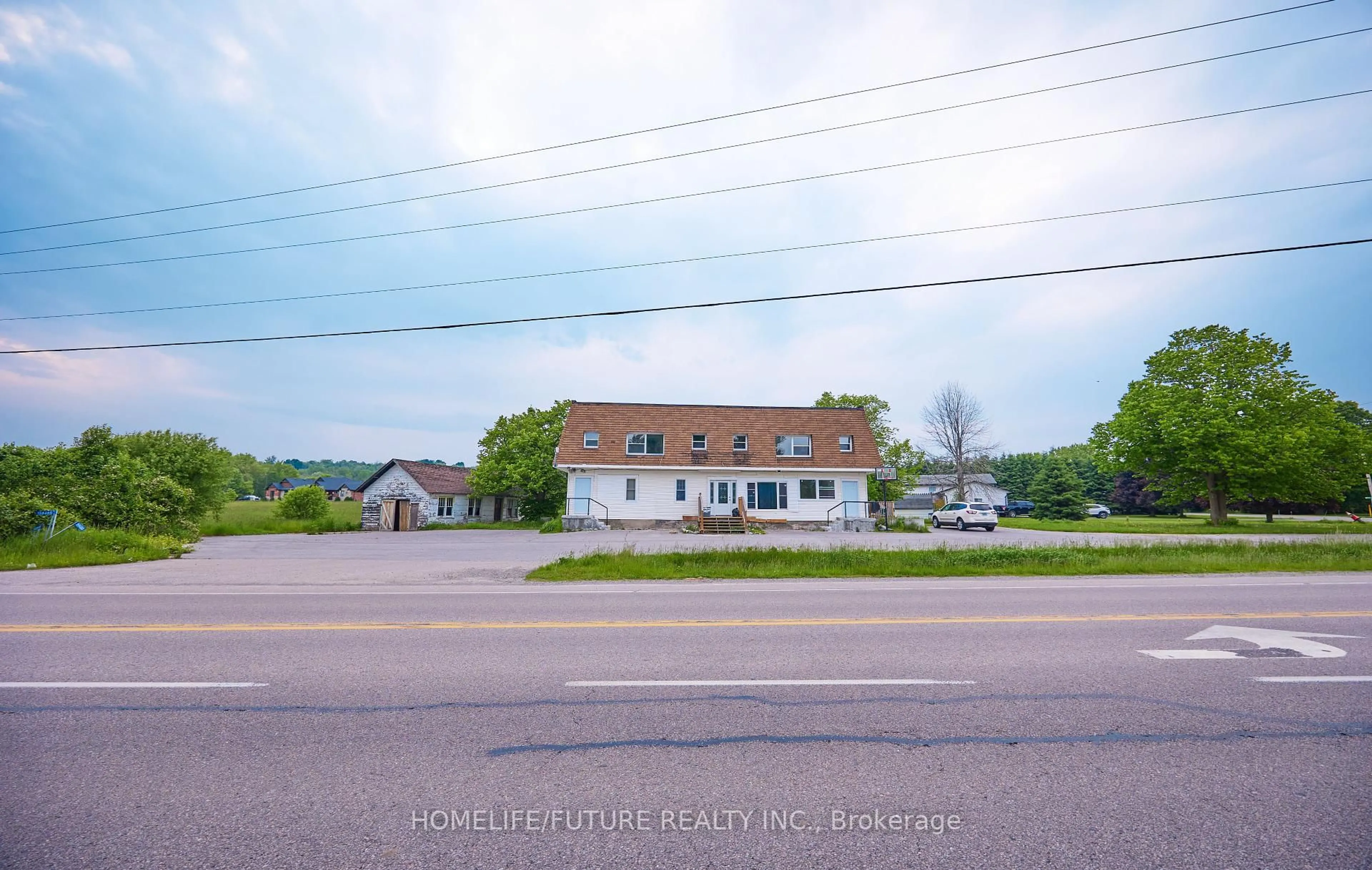 A pic from outside/outdoor area/front of a property/back of a property/a pic from drone, street for 15946 County Road 2, Brighton Ontario K0K 1H0
