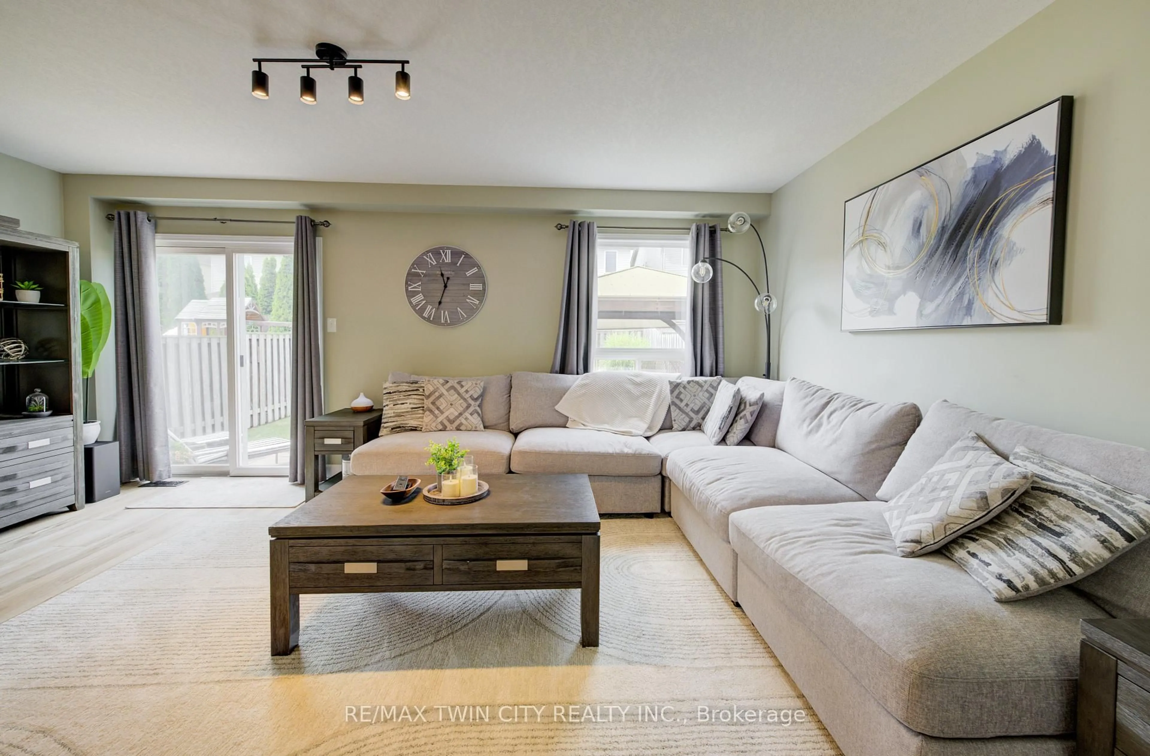 Living room with furniture, wood/laminate floor for 1533 Old Zeller Dr, Kitchener Ontario N2A 0B3