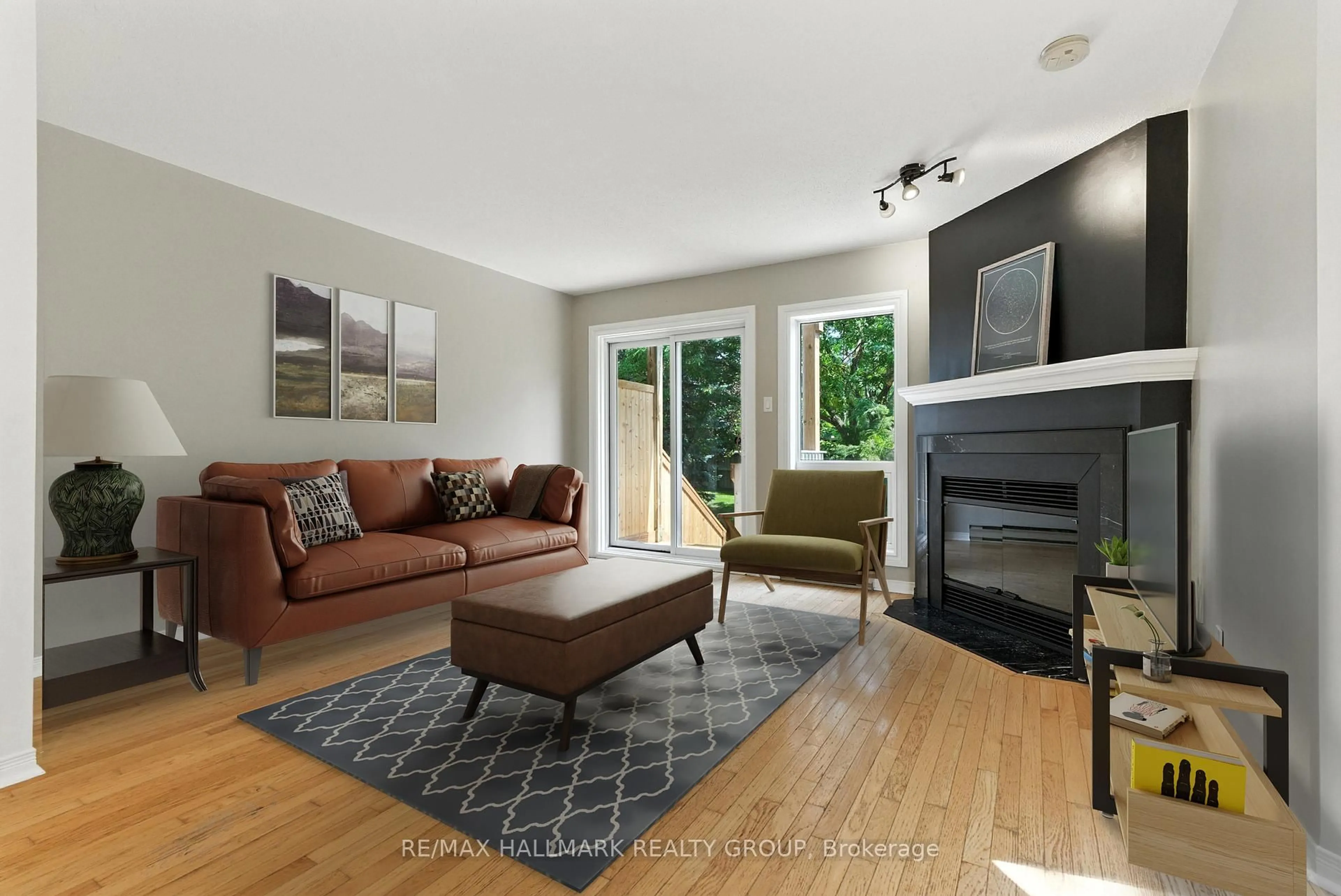 Living room with furniture, wood/laminate floor for 214 Briston Private, Ottawa Ontario K1G 5P9