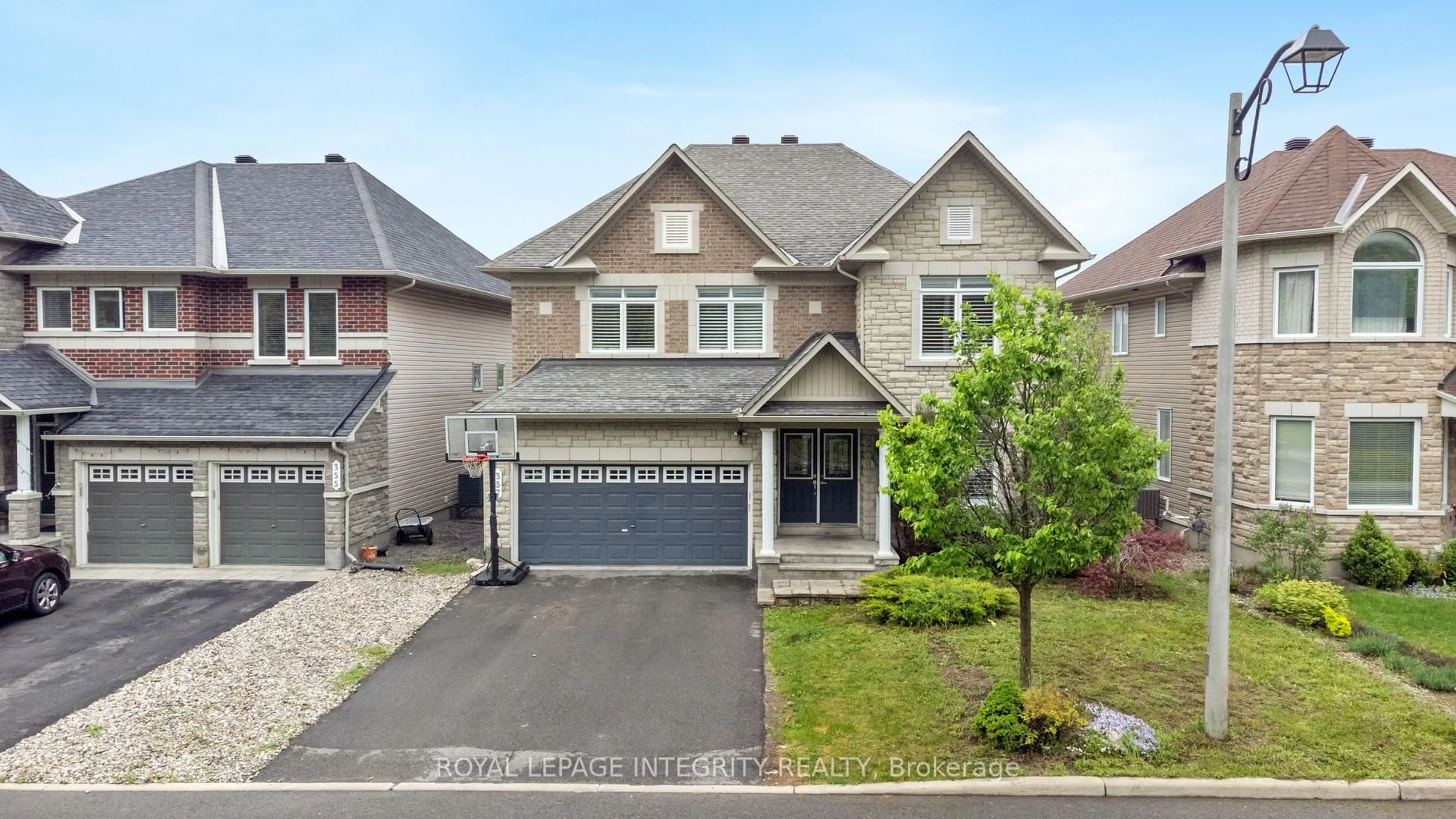 A pic from outside/outdoor area/front of a property/back of a property/a pic from drone, street for 357 Langrell Cres, Ottawa Ontario K2J 5R8