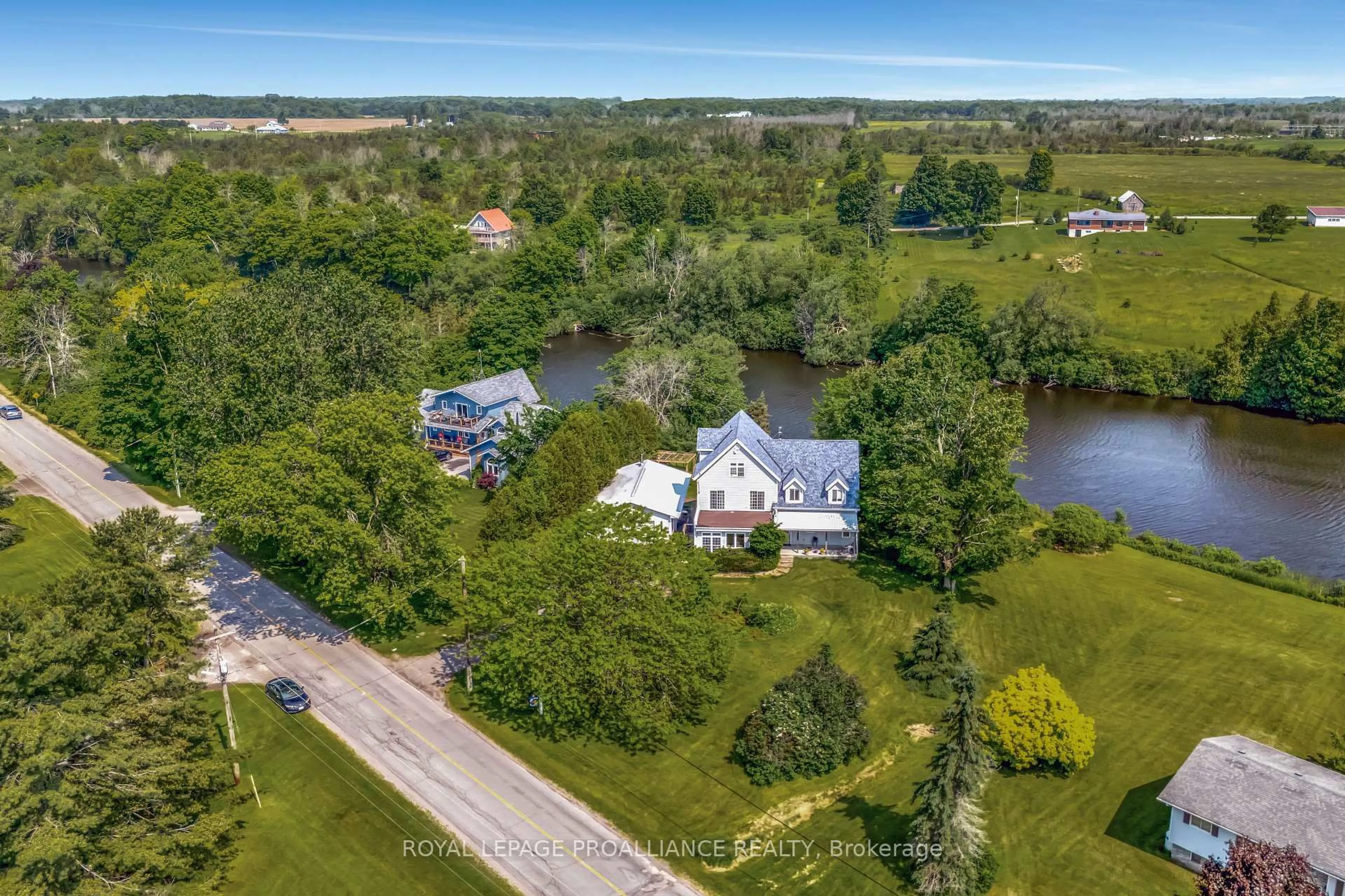 A pic from outside/outdoor area/front of a property/back of a property/a pic from drone, water/lake/river/ocean view for 2925 County Road 10, Prince Edward County Ontario K0K 2P0