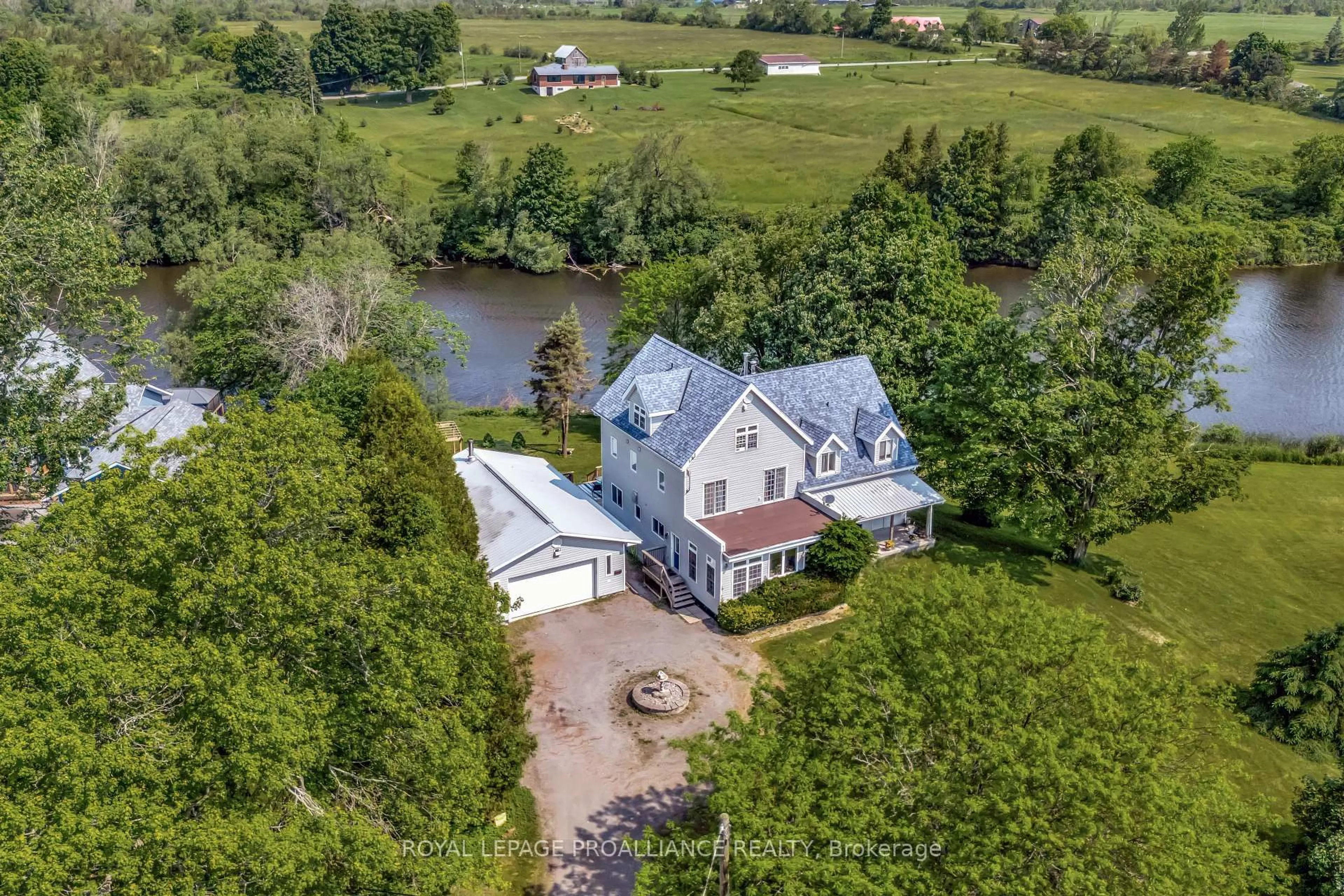 A pic from outside/outdoor area/front of a property/back of a property/a pic from drone, water/lake/river/ocean view for 2925 County Road 10, Prince Edward County Ontario K0K 2P0