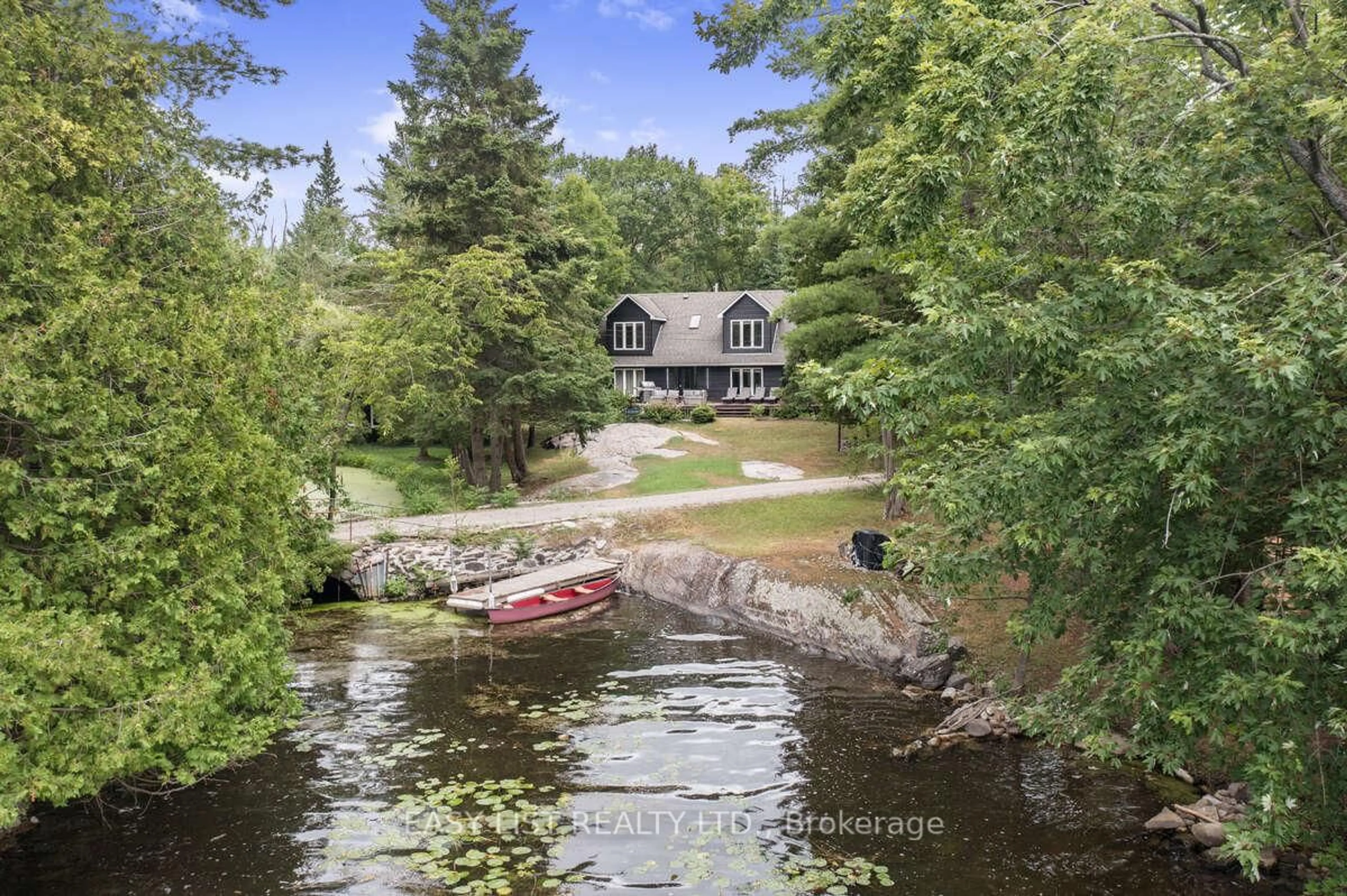 A pic from outside/outdoor area/front of a property/back of a property/a pic from drone, water/lake/river/ocean view for 64 Fire Route 96, Trent Lakes Ontario K0M 1A0