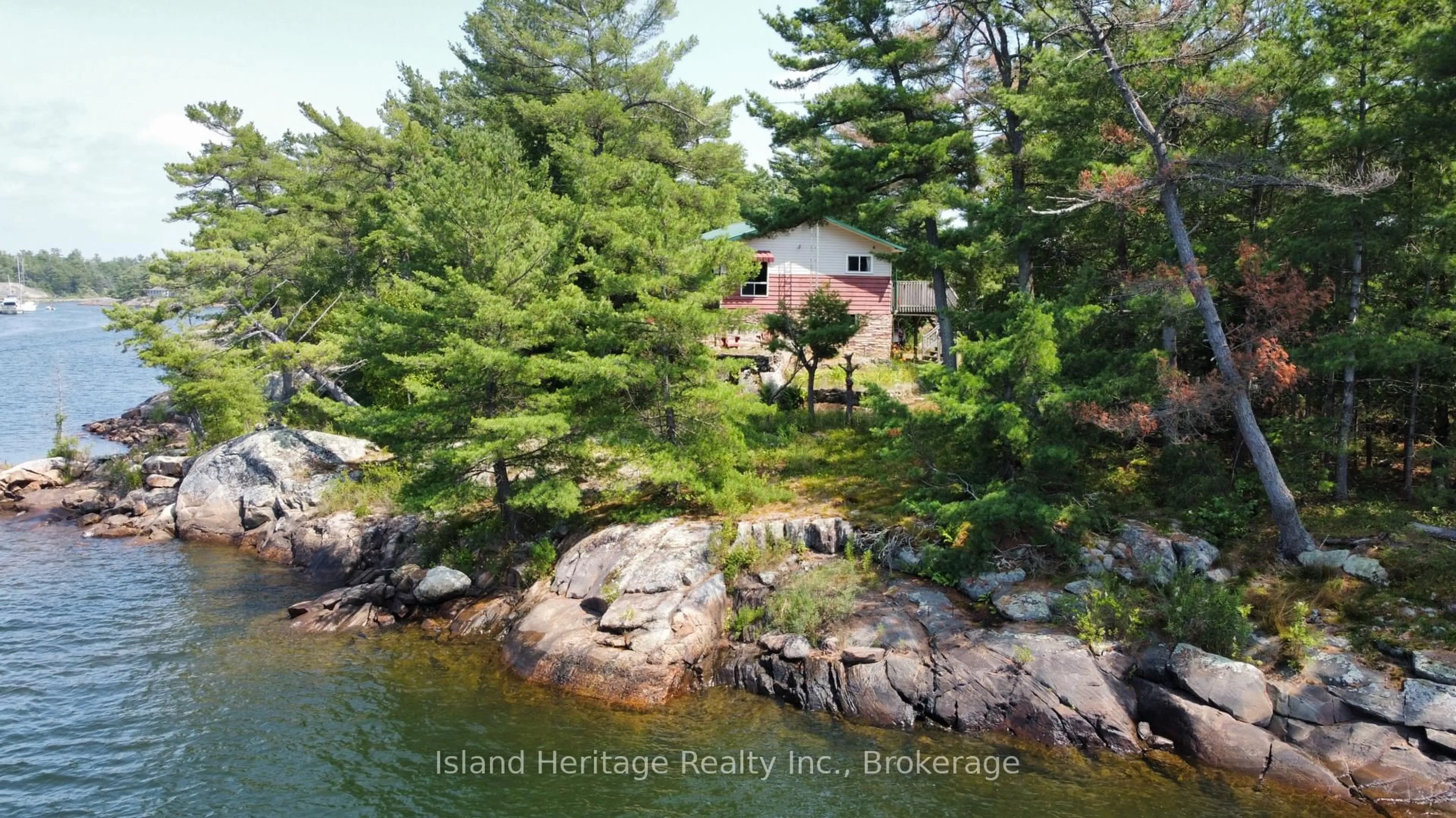 A pic from outside/outdoor area/front of a property/back of a property/a pic from drone, water/lake/river/ocean view for 1915 Georgian Bay Island, The Archipelago Ontario P0G 1K0