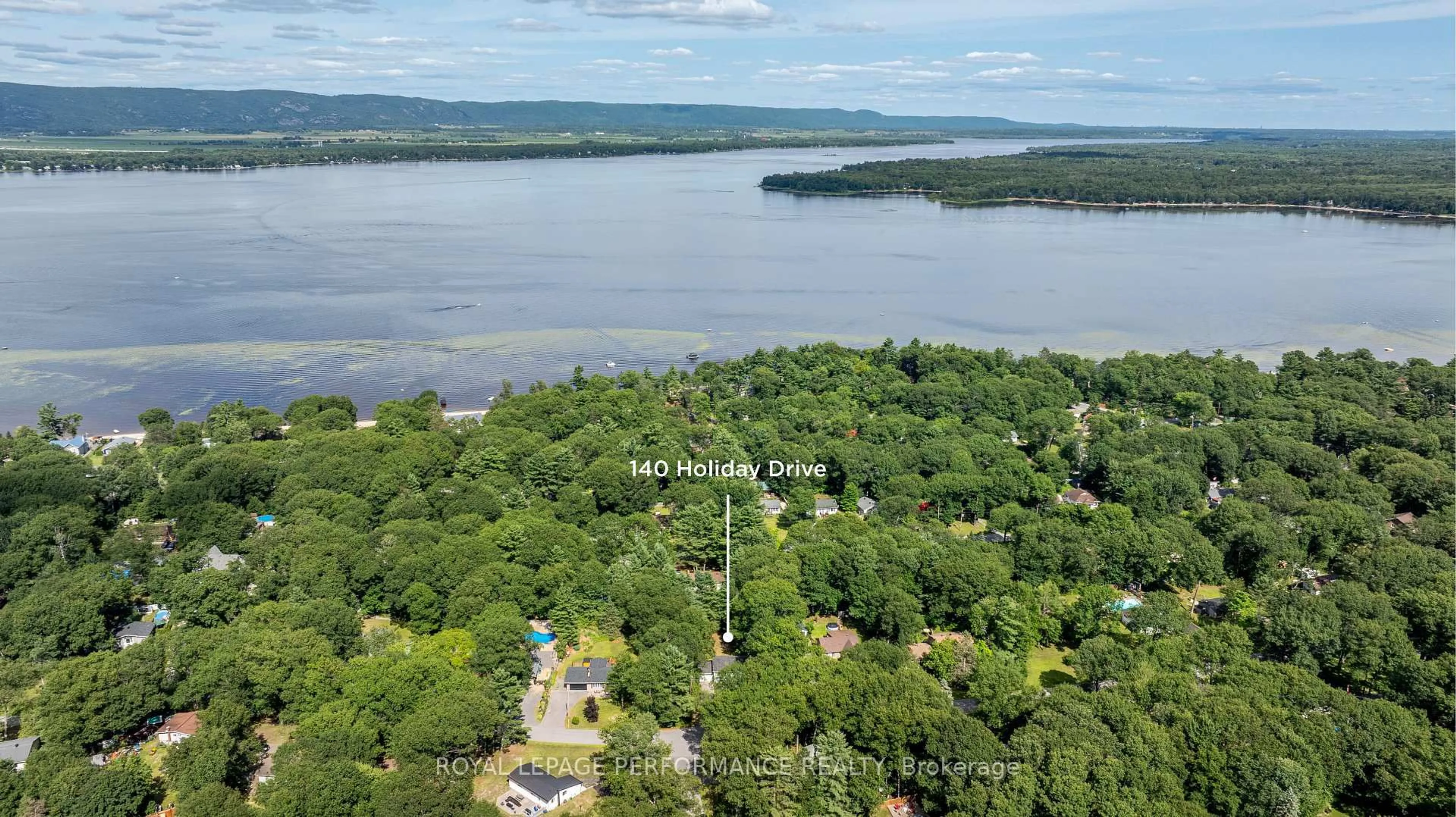 A pic from outside/outdoor area/front of a property/back of a property/a pic from drone, water/lake/river/ocean view for 140 Holiday Dr, Ottawa Ontario K0A 3M0