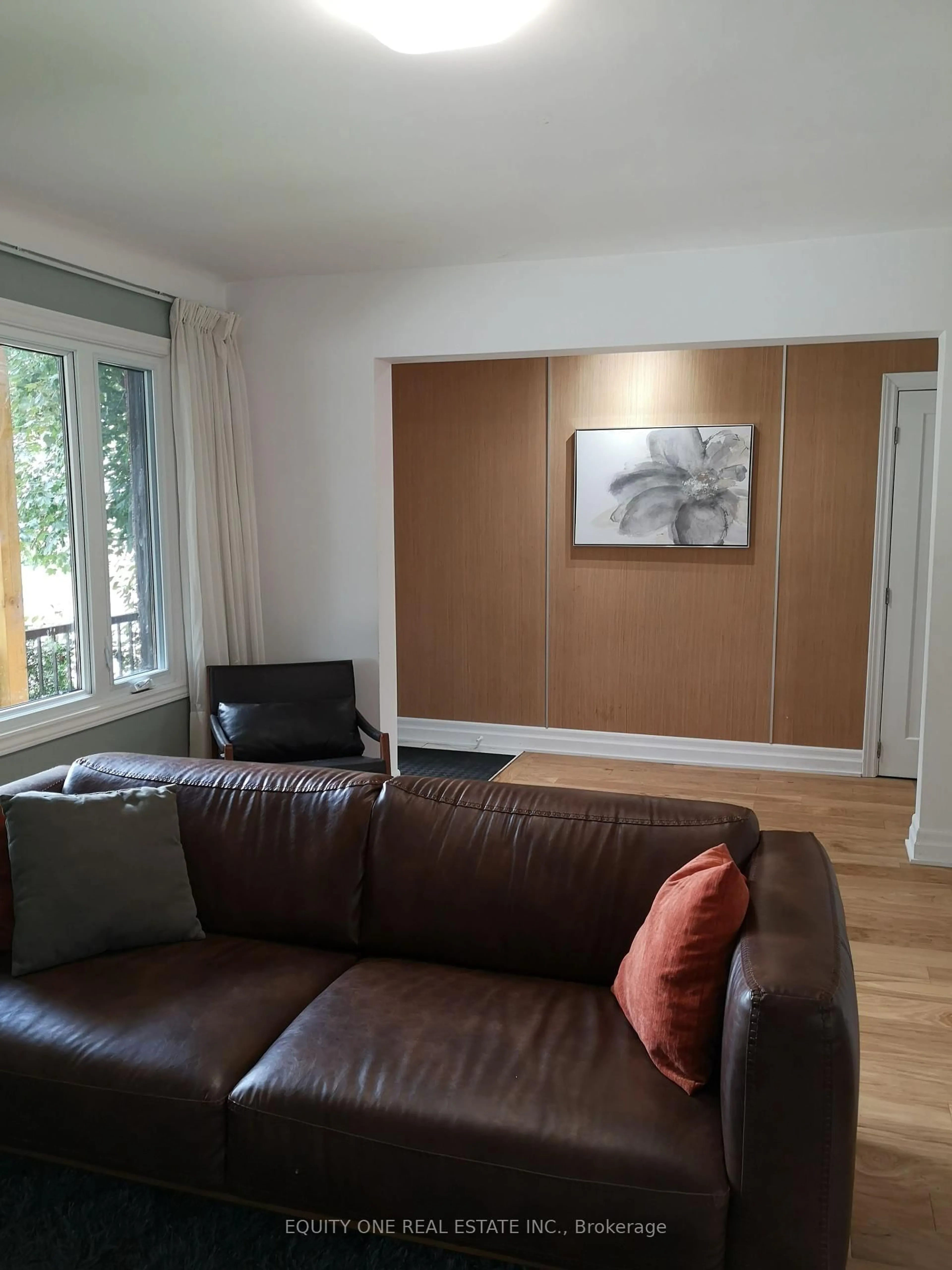 Living room with furniture, wood/laminate floor for 366 Maria Goretti Circ, Ottawa Ontario K1L 7K8