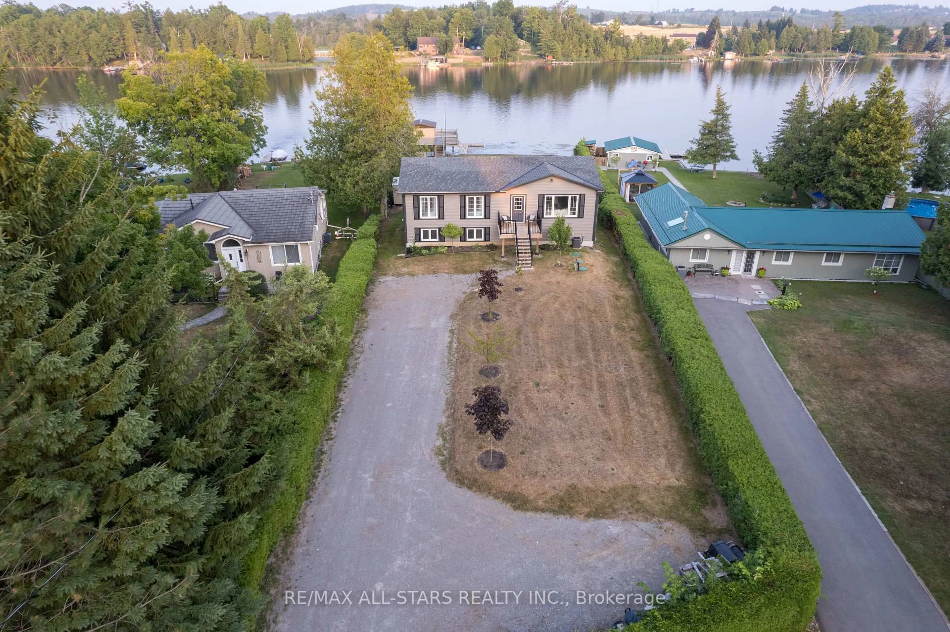 A pic from outside/outdoor area/front of a property/back of a property/a pic from drone, water/lake/river/ocean view for 16 Kenver St, Kawartha Lakes Ontario K0L 2W0