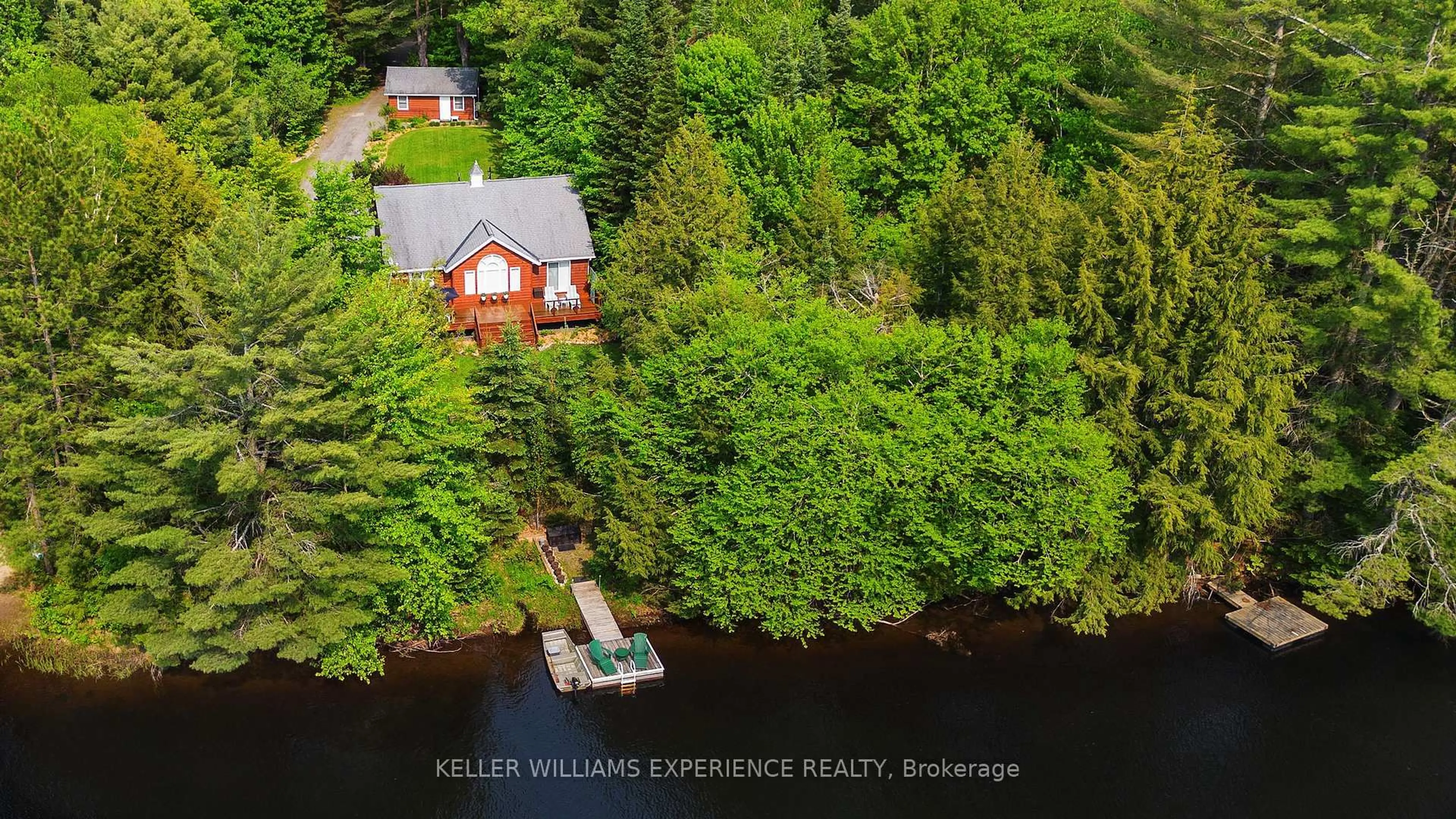 A pic from outside/outdoor area/front of a property/back of a property/a pic from drone, water/lake/river/ocean view for 1065 Forrester Tr, Bracebridge Ontario P1L 1W9