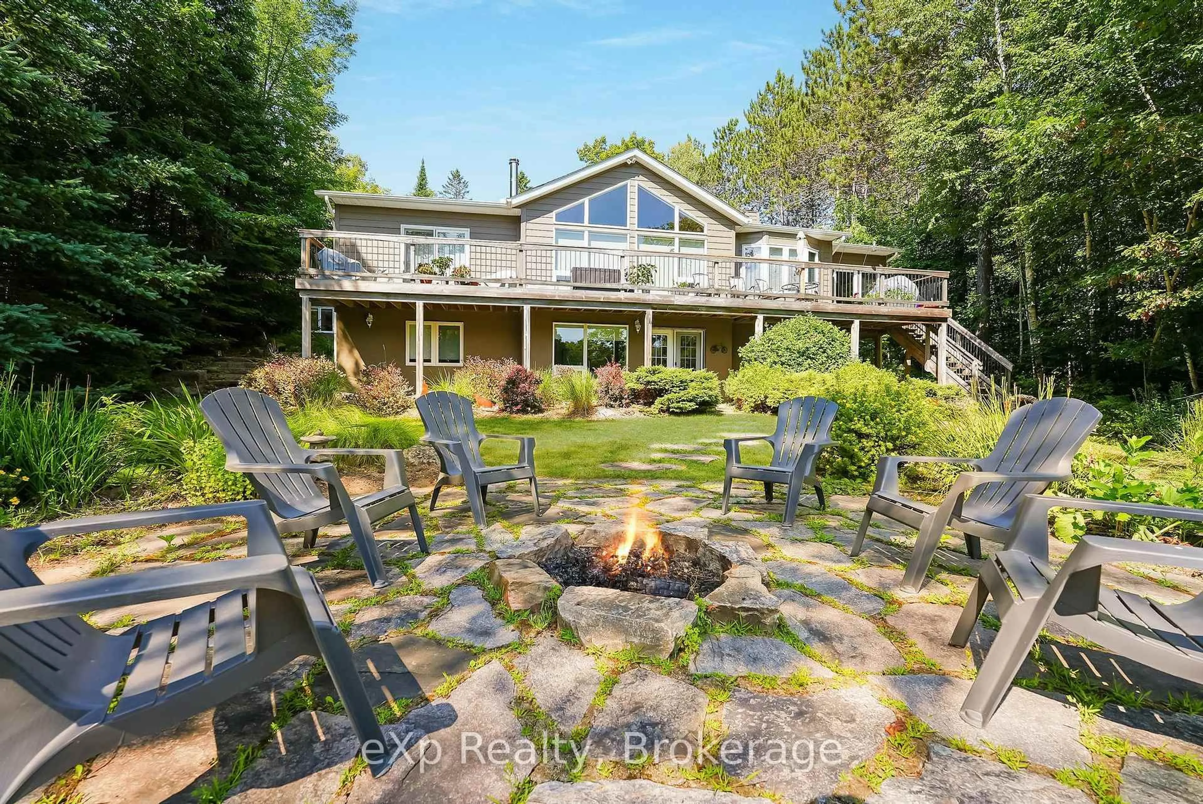 A pic from outside/outdoor area/front of a property/back of a property/a pic from drone, water/lake/river/ocean view for 2978 Kashagawigamog Lake Rd, Dysart et al Ontario K0M 1S0