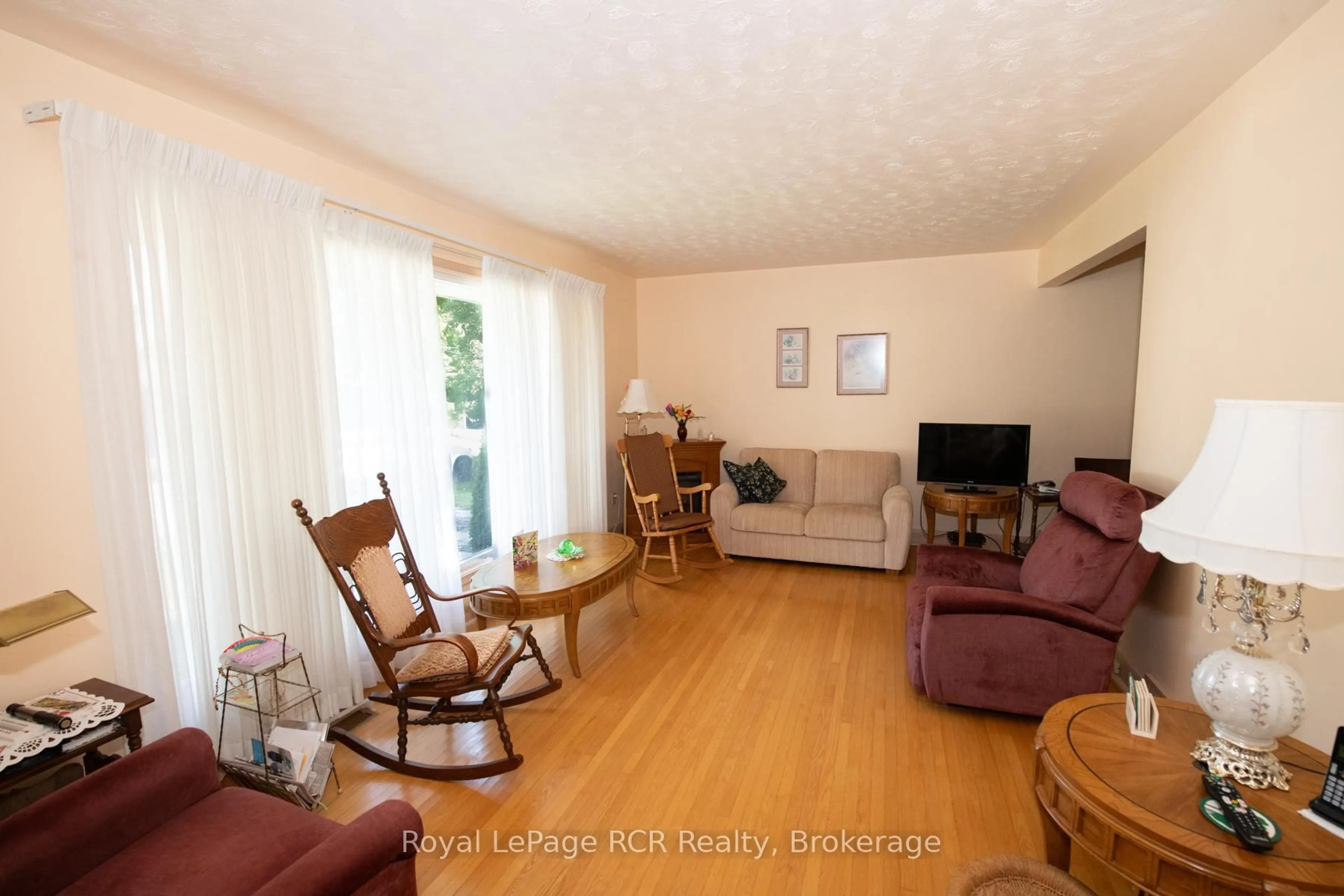 Living room with furniture, wood/laminate floor for 258 BIRMINGHAM St, Wellington North Ontario N0G 2L1