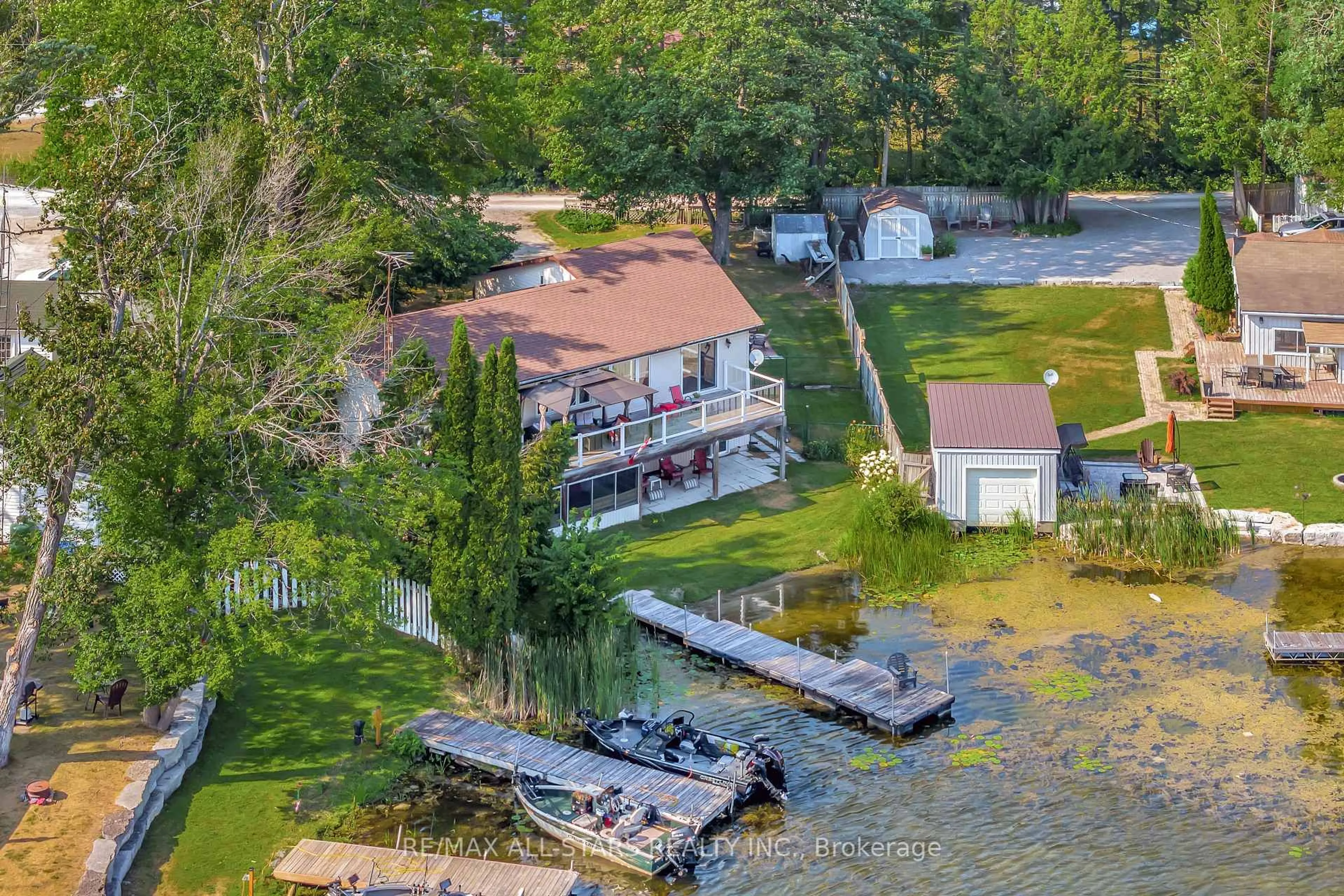 A pic from outside/outdoor area/front of a property/back of a property/a pic from drone, water/lake/river/ocean view for 16 Fire Route 122, Trent Lakes Ontario K0M 1A0