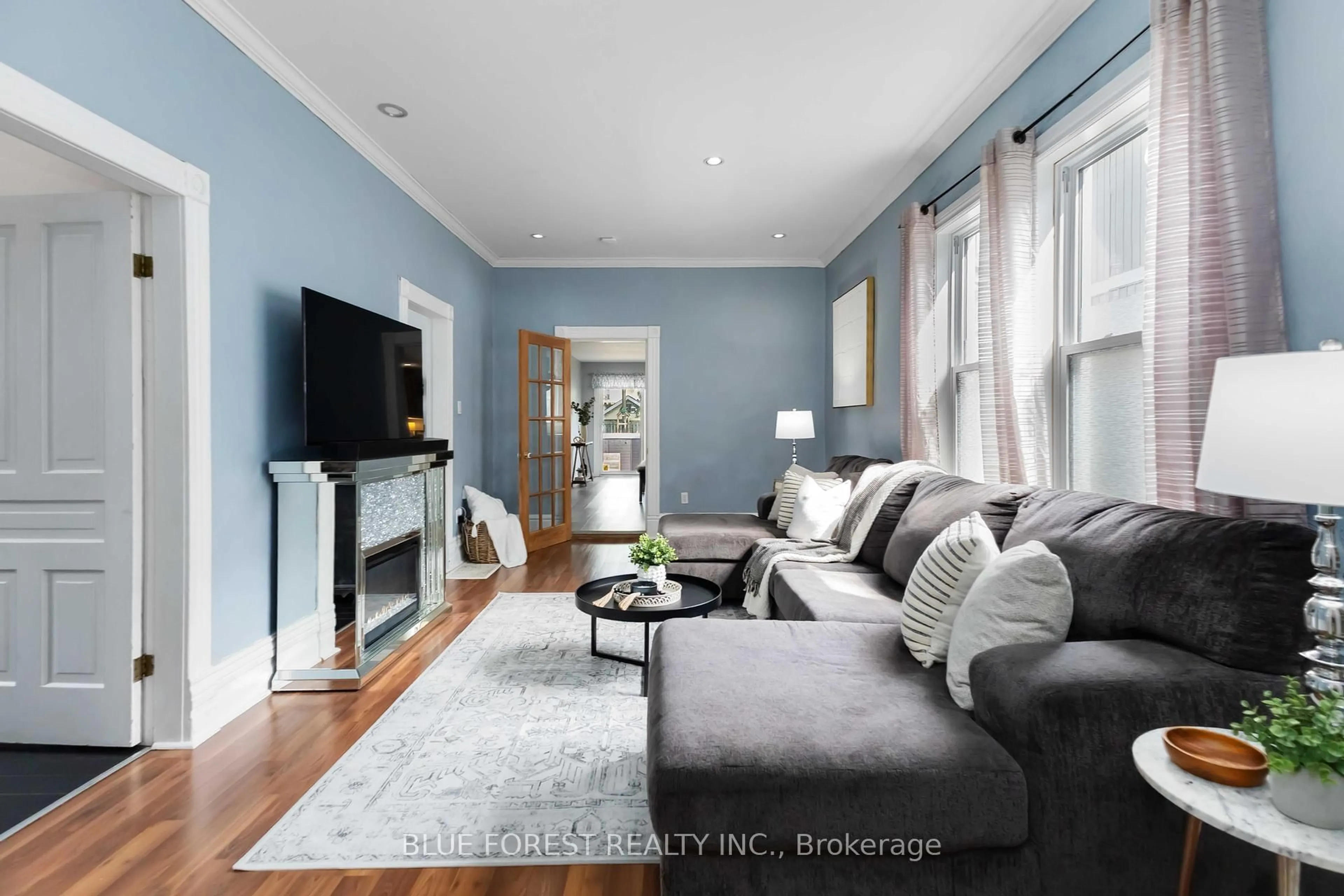 Living room with furniture, wood/laminate floor for 476 Emery St, London South Ontario N6C 2E8