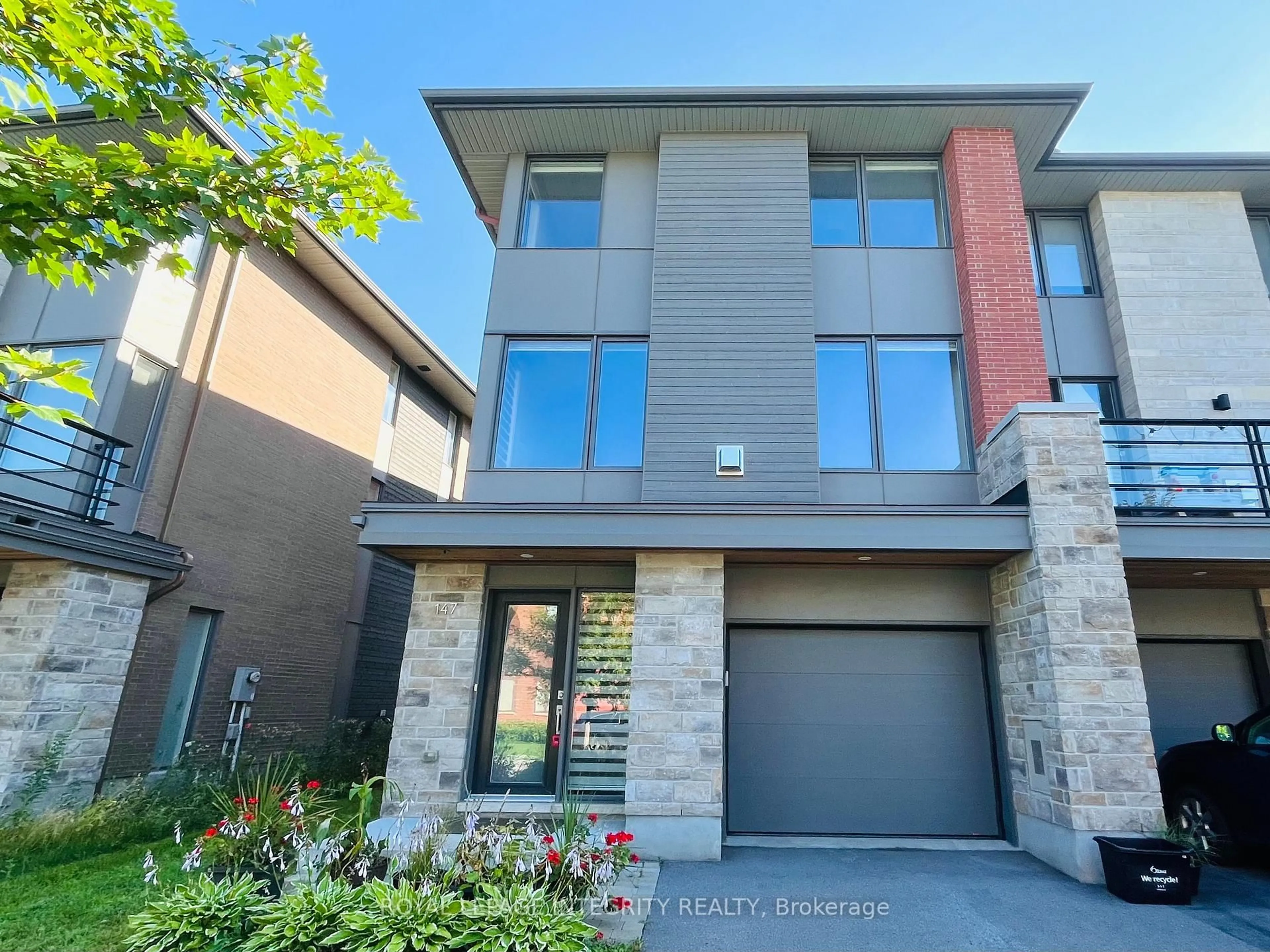 Home with brick exterior material, street for 147 Boundstone Way, Ottawa Ontario K2T 0M4