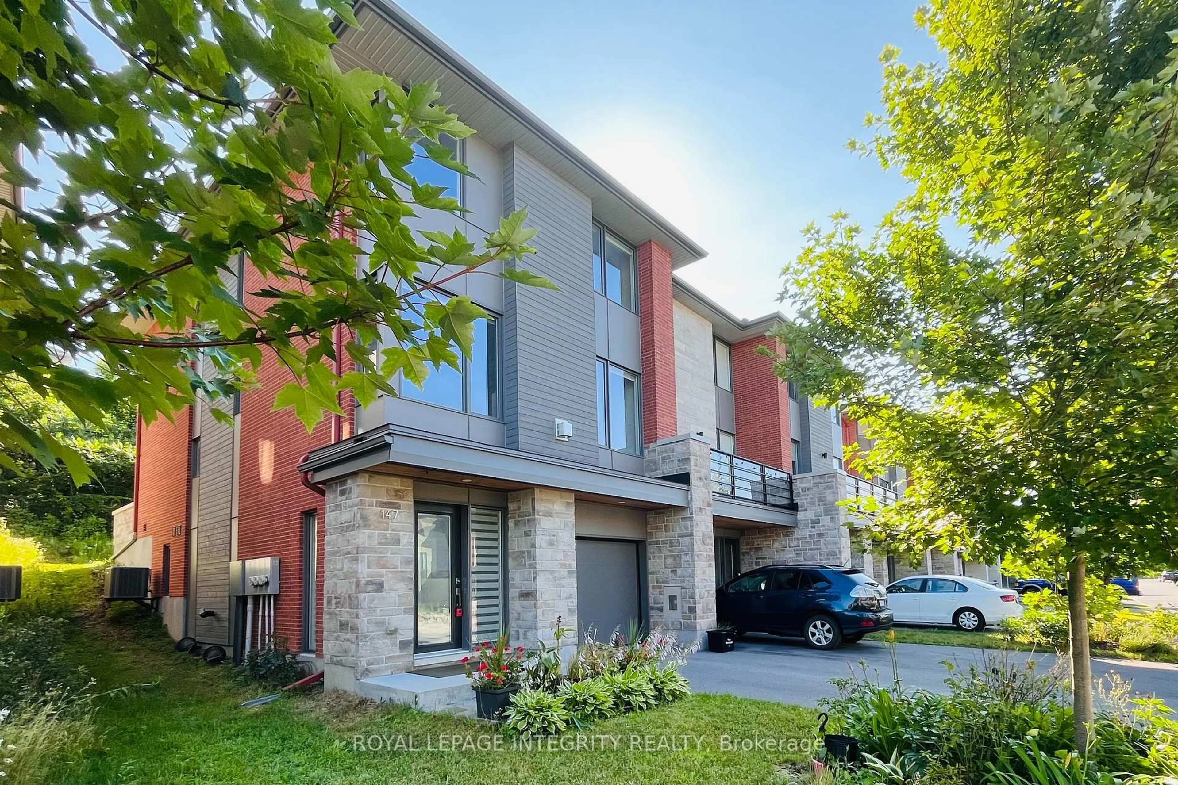 Home with brick exterior material, street for 147 Boundstone Way, Ottawa Ontario K2T 0M4