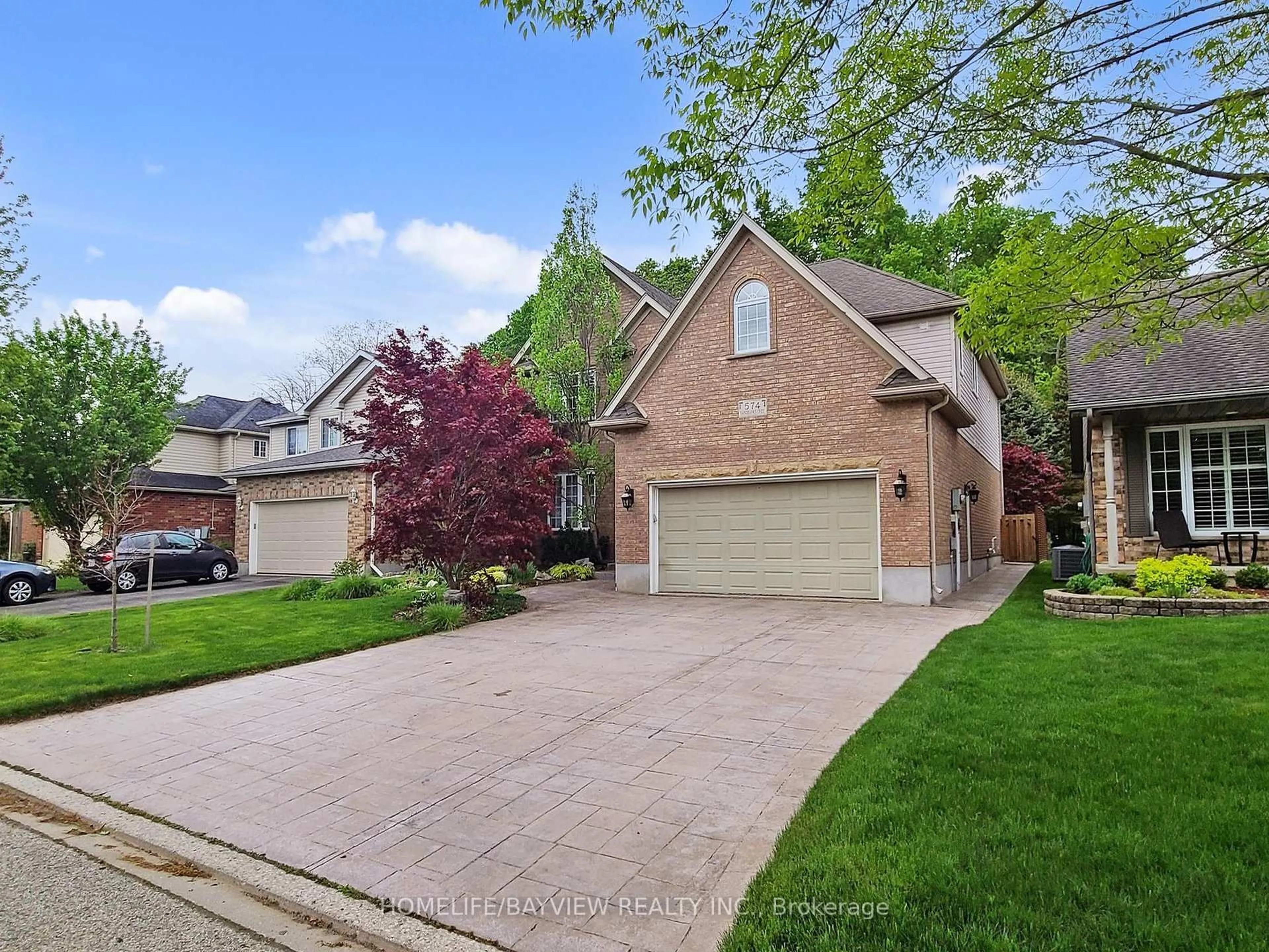 Home with brick exterior material, street for 574 Sandbanks Cres, Waterloo Ontario N2V 2K2