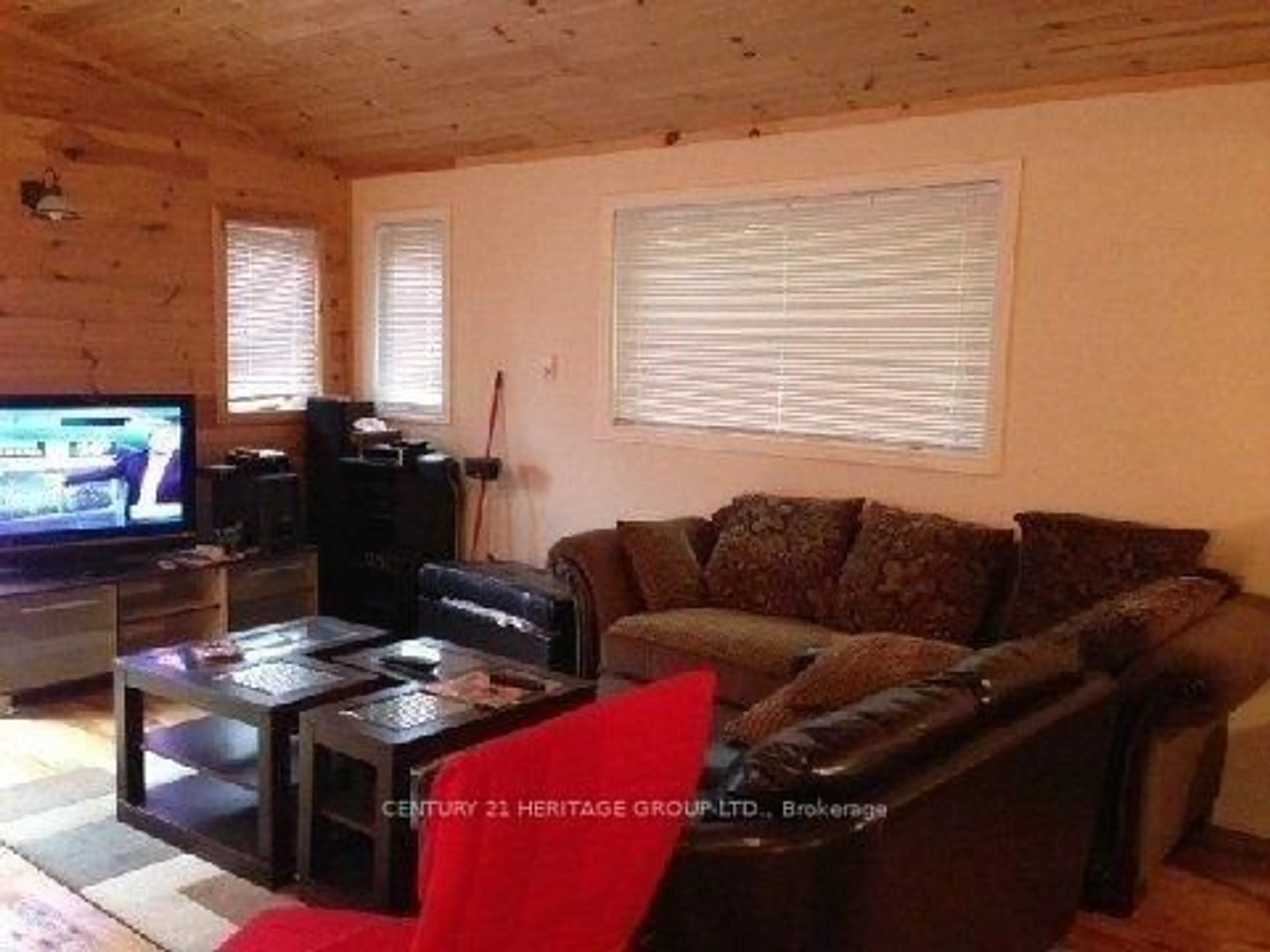 Living room with furniture, wood/laminate floor for 759 Maguire Rd, Asphodel-Norwood Ontario K0L 1Y0