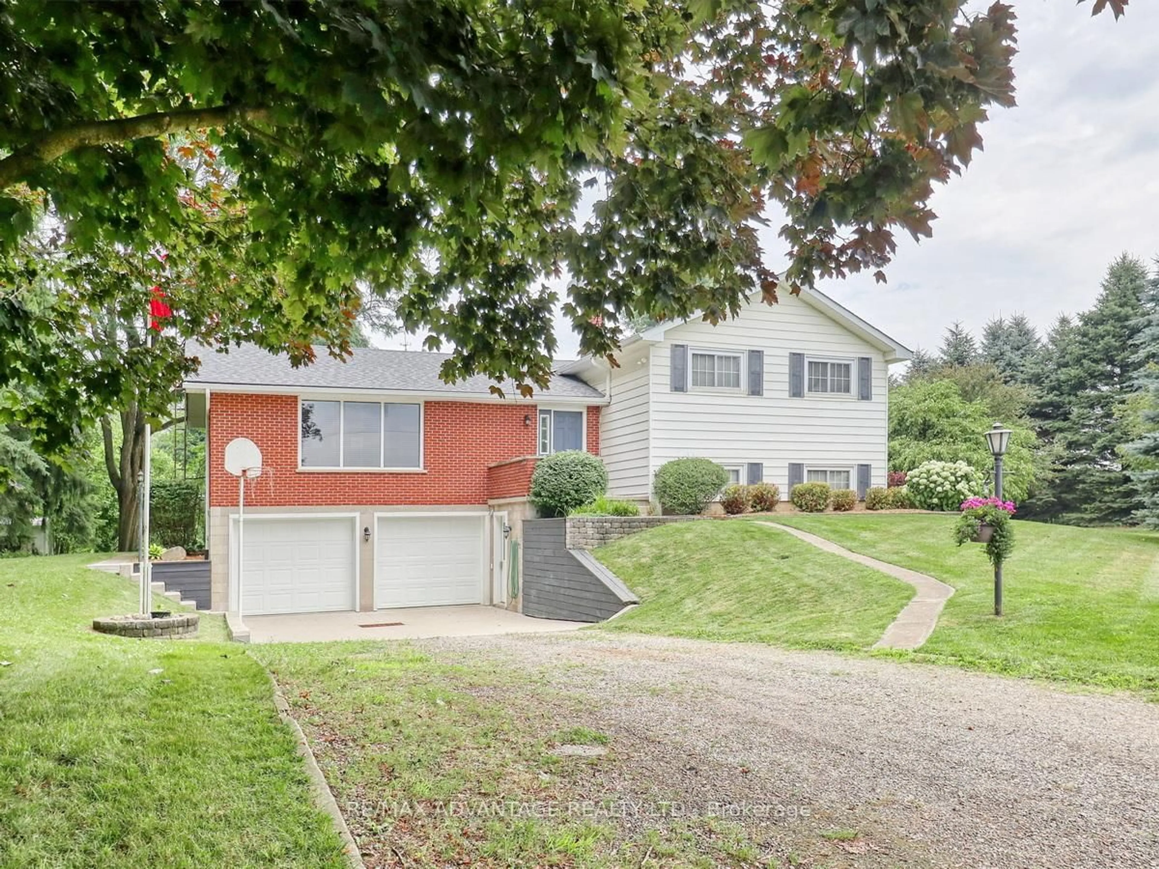 Home with vinyl exterior material, street for 17248 Wyton Dr, Thames Centre Ontario N0M 2P0