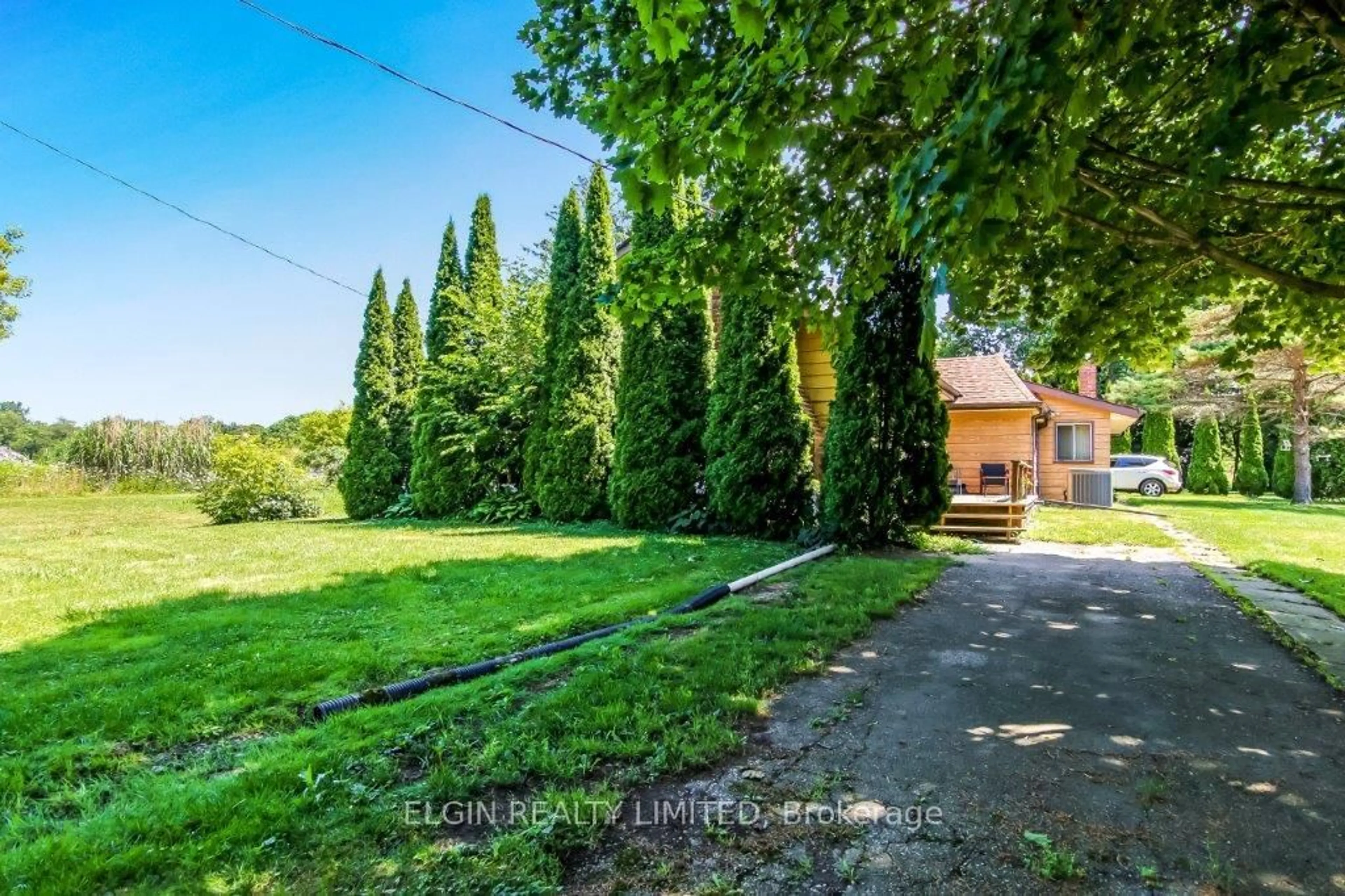 A pic from outside/outdoor area/front of a property/back of a property/a pic from drone, forest/trees view for 6378 Sunset Rd, Central Elgin Ontario N5P 3S8