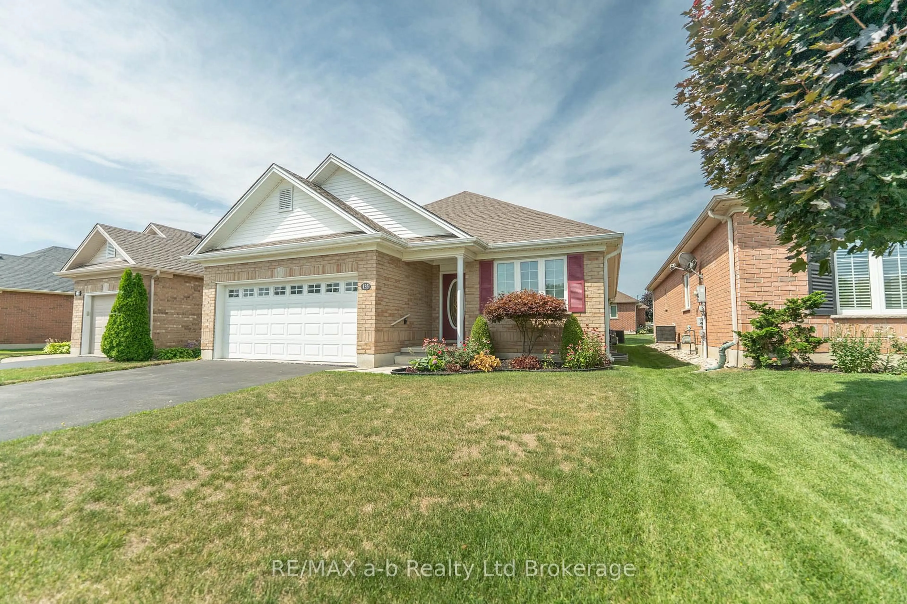 Home with brick exterior material, street for 135 Weston Dr, Tillsonburg Ontario N4G 5X1