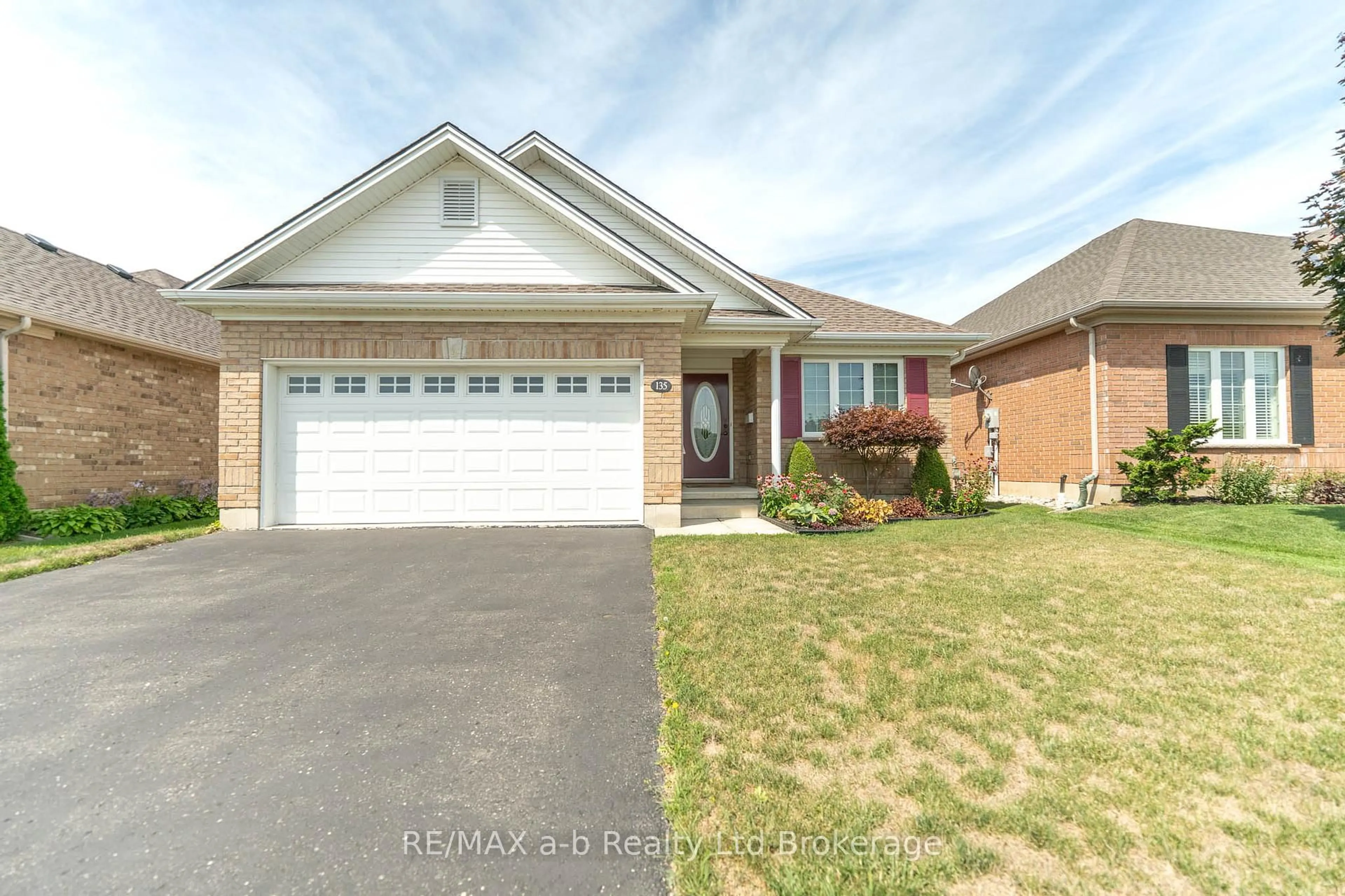 Home with brick exterior material, street for 135 Weston Dr, Tillsonburg Ontario N4G 5X1