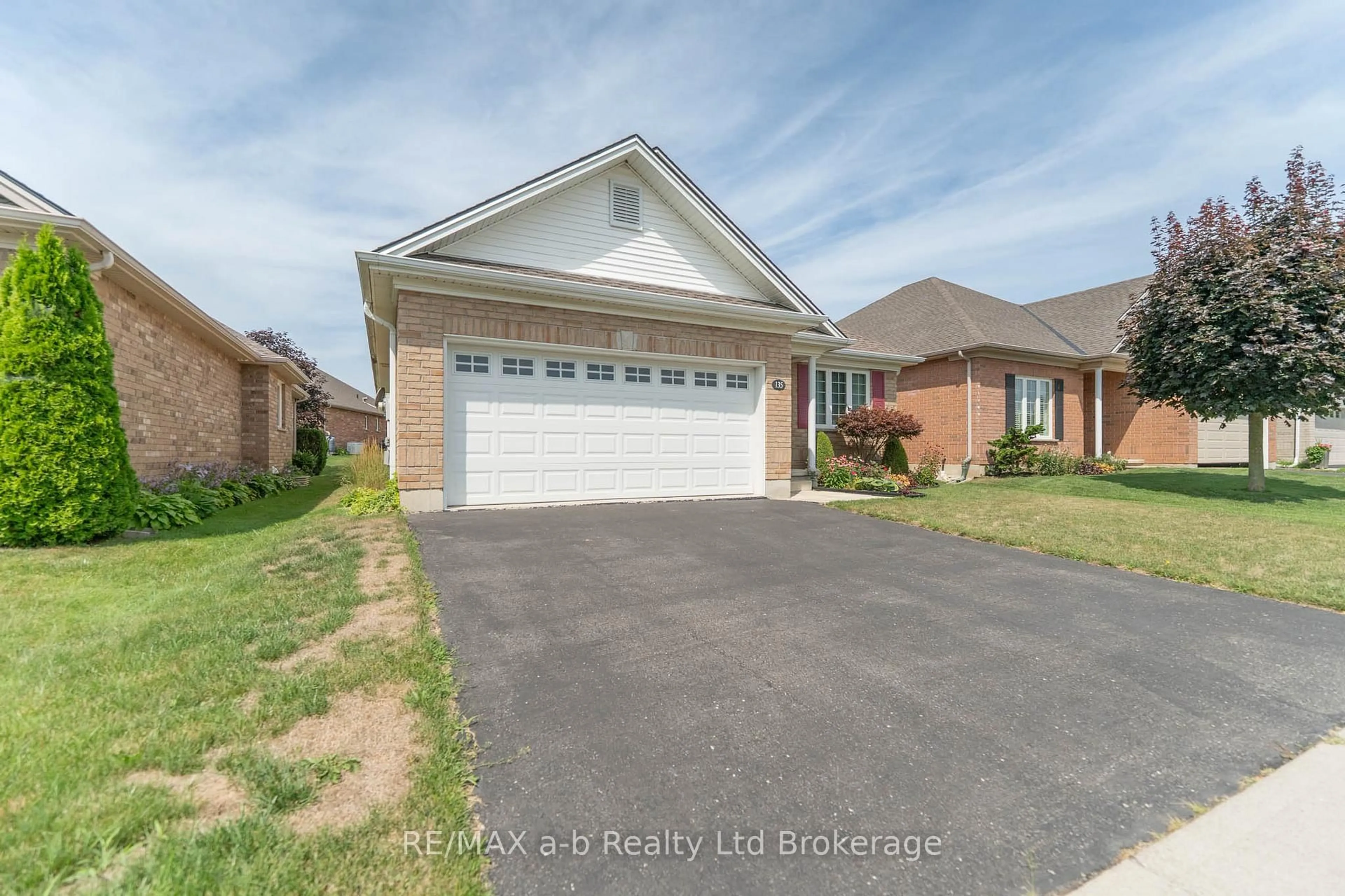 Home with brick exterior material, street for 135 Weston Dr, Tillsonburg Ontario N4G 5X1