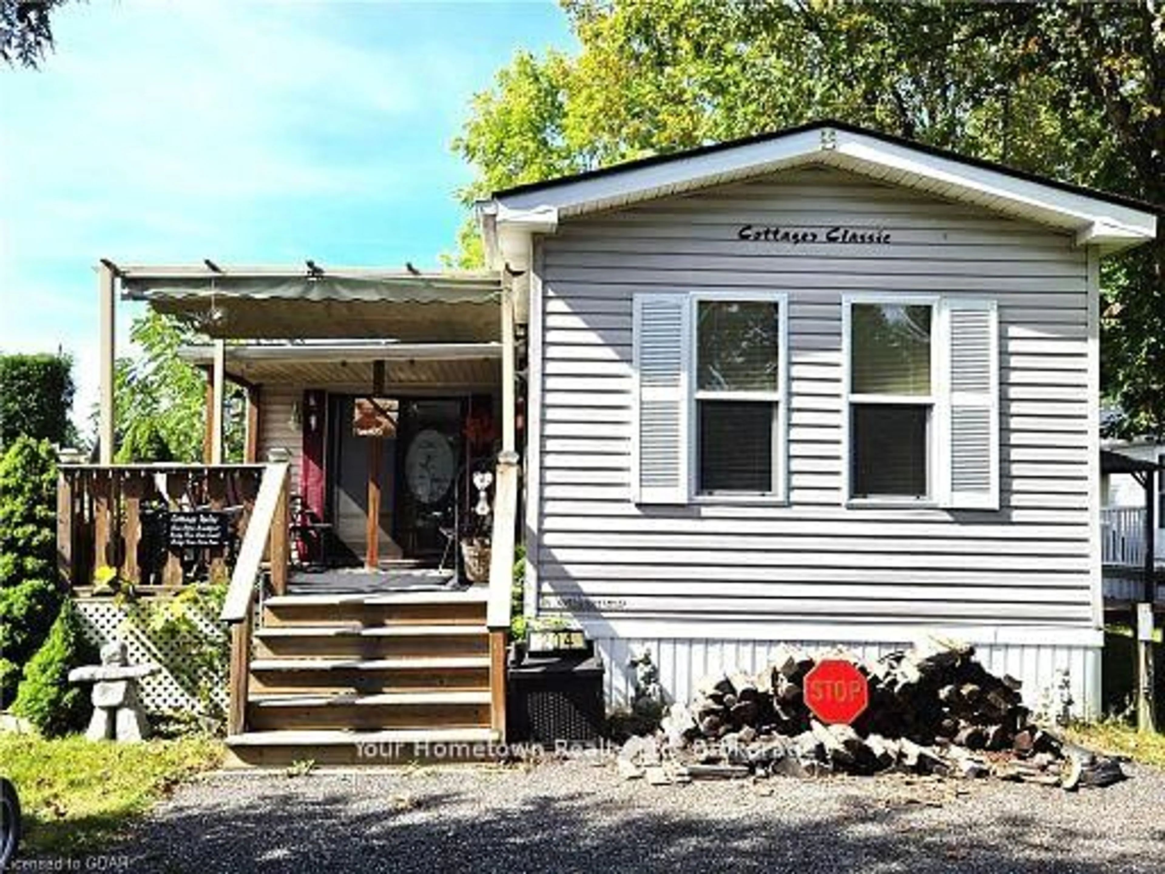Home with vinyl exterior material, street for 204 Beach Rd, Centre Wellington Ontario N1M 2W5