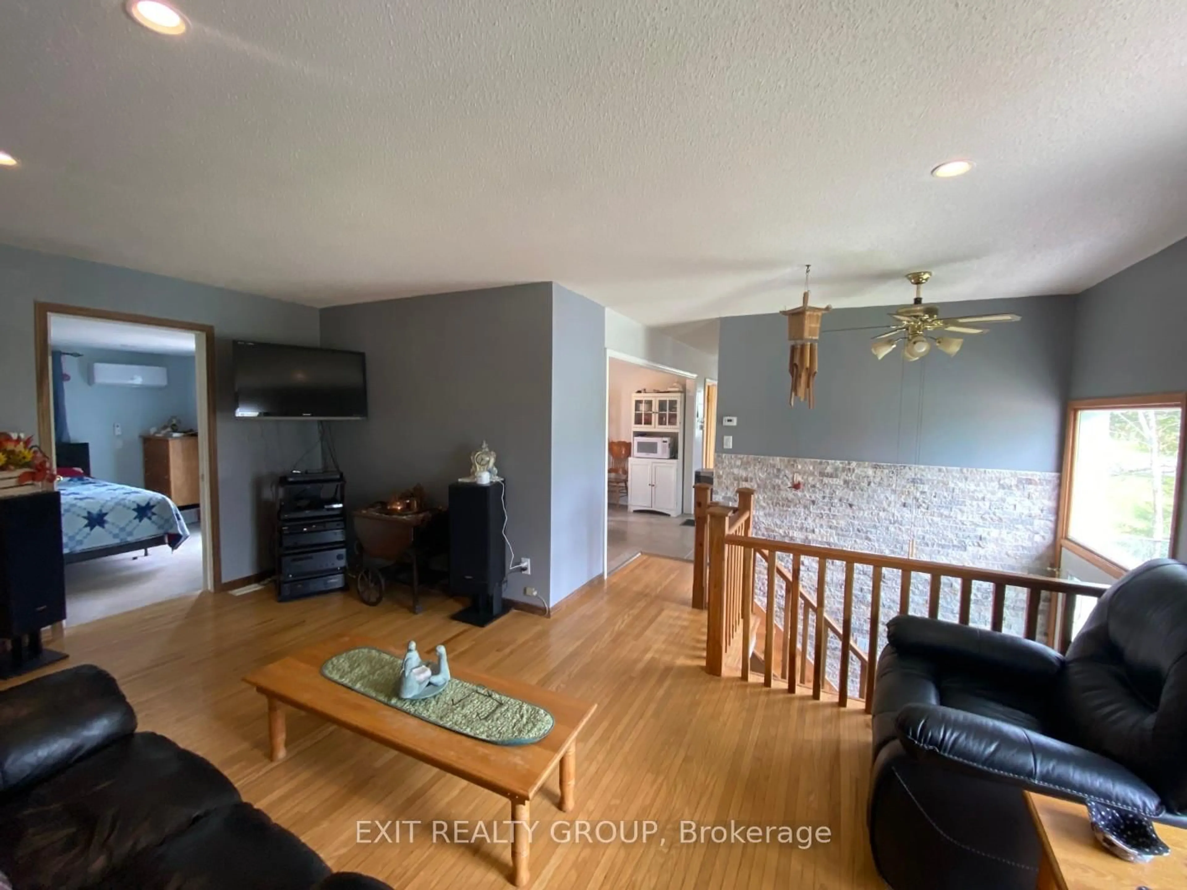 Living room with furniture, wood/laminate floor for 87 Bernard Long Rd, Quinte West Ontario K8V 5P6