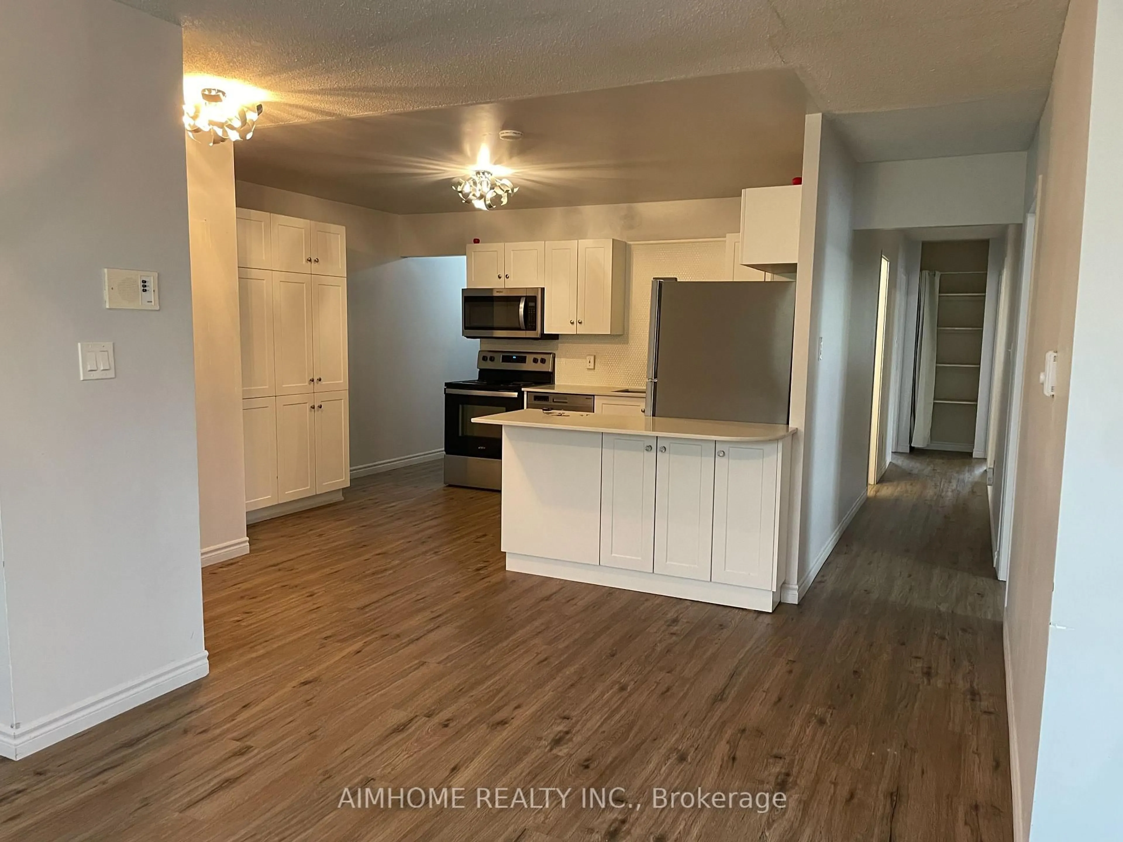 Open concept kitchen, wood/laminate floor for 113 Westmount Rd #1, Waterloo Ontario N2L 5G5