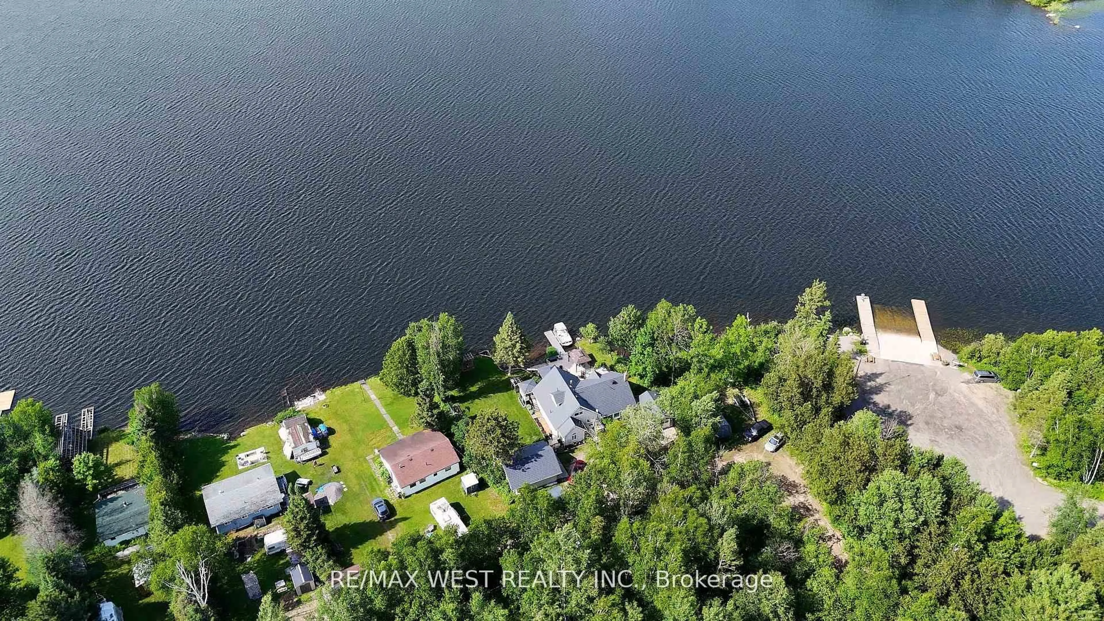 A pic from outside/outdoor area/front of a property/back of a property/a pic from drone, water/lake/river/ocean view for 38 Turgeon Lane, East Ferris Ontario P0H 1B0