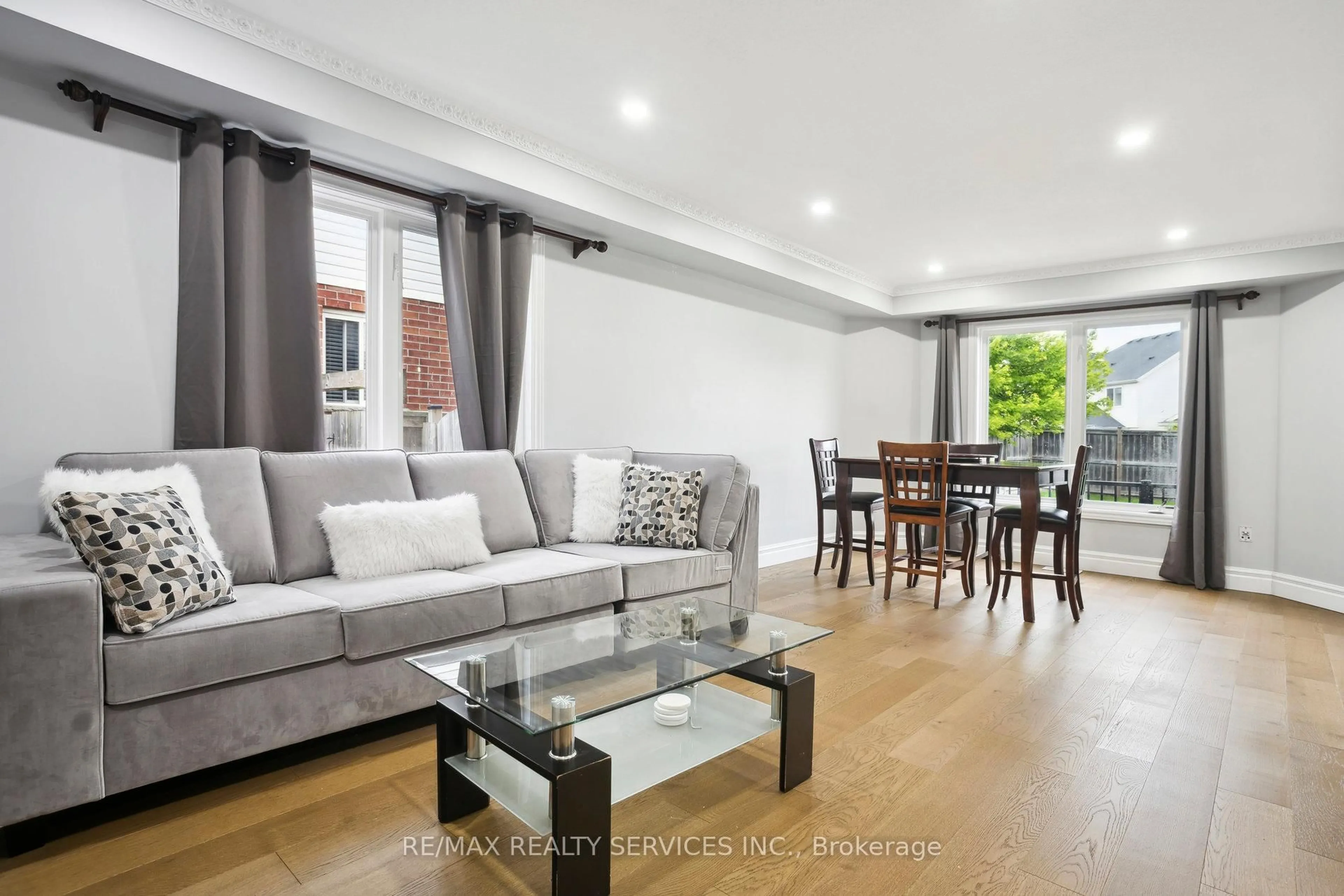 Living room with furniture, wood/laminate floor for 1182 Silverfox Dr, London North Ontario N6G 0C8